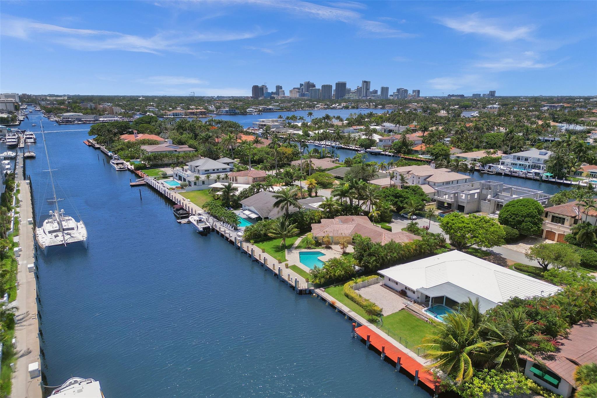 REDUCED! GRAB THIS HUGE 13,000 SQ FT LOT WITH 5 BEDROOMS, 3 BATHS, 2 MASTER SUITES! Waterfront in desirable location with a private beach club and security ! HB club has picnic, BBQ, restrooms. This home is spacious and comfortable for family living and a pool for entertaining guests.  A new roof was installed for peace of mind with impact windows! This house is ready for personal touches or redesign! This property has a wide and deep canal for easy maneuverability for yachts and catamarans. This nostalgic property is ideal for boating enthusiasts, minutes to Port Everglades, downtown and beach restaurants and numerous water activities. This property combines a luxurious neighborhood and functionality making it the perfect waterfront retreat!Seller is open to all reasonable offers! Hop on a golf cart for a ride to the beach!5-10 minute bike ride to beach and restaurants on prestigious Las Olas and SE 17 street!Numerous Ft Lauderdale Special Events all year long, to include Tortuga Festival and worlds largest Boat Show!