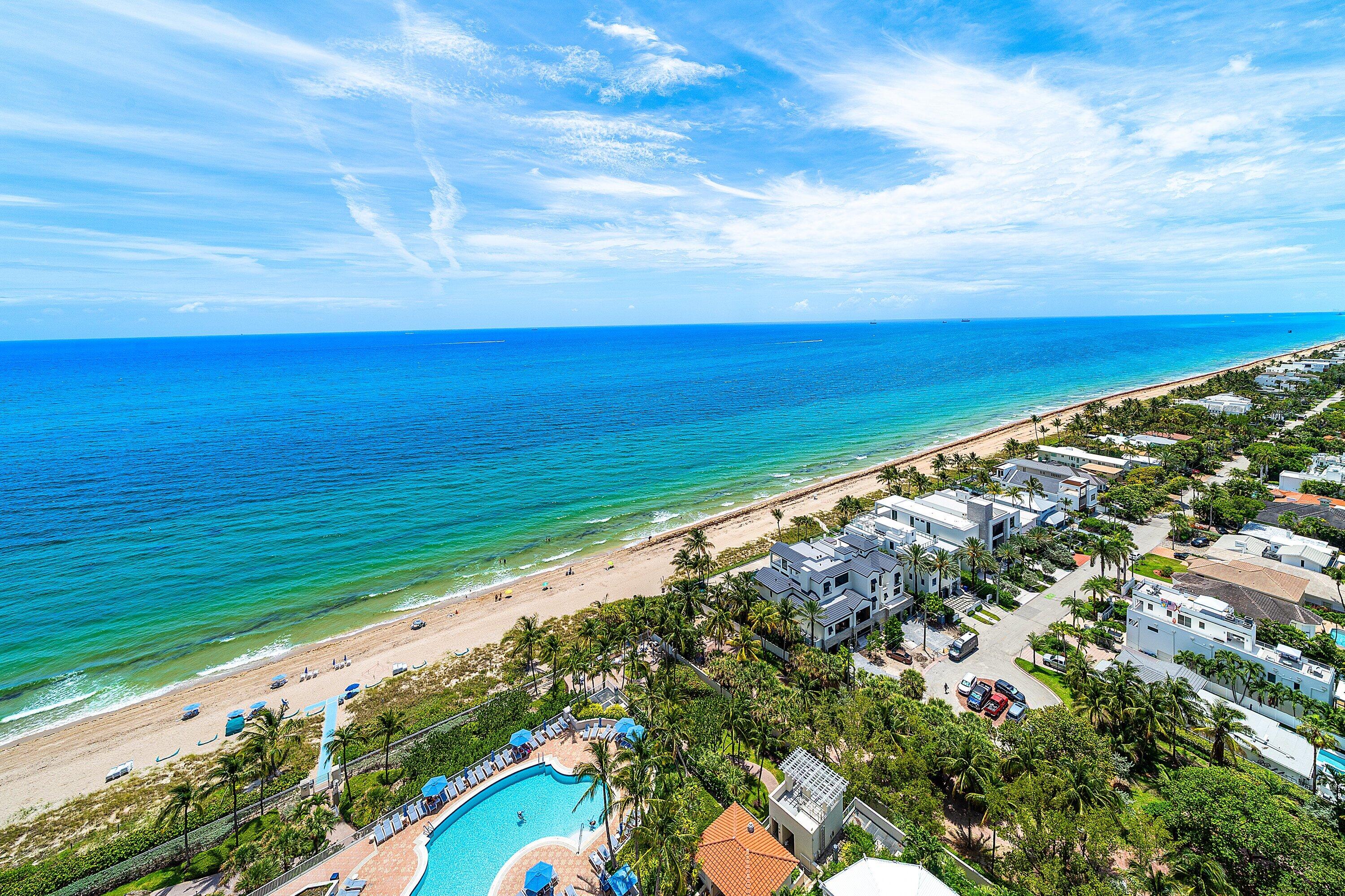 Enjoy breathtaking ocean views from this High Floor beautifully and updated 3 bedroom residence (third bedroom open den). The private elevator opens directly into the unit, leading to an absolutely gorgeous new kitchen with a large island and high end appliances, new wood flooring, and elegantly renovated bathrooms. The Master Bedroom is on the Ocean Side so you can wake up to stunning Sunrises. The expansive wraparound balcony showcases endless ocean and beach views overlooking the resort-style pools. Features Include two garage parking spaces plus valet service. L'Hermitage offers over 10 acres of oceanfront luxury with a guard gate and 24/7 security, two pools, two spas, a poolside café with a monthly maintenance credit, fitness center, two clay tennis courts, and pet-friendly.