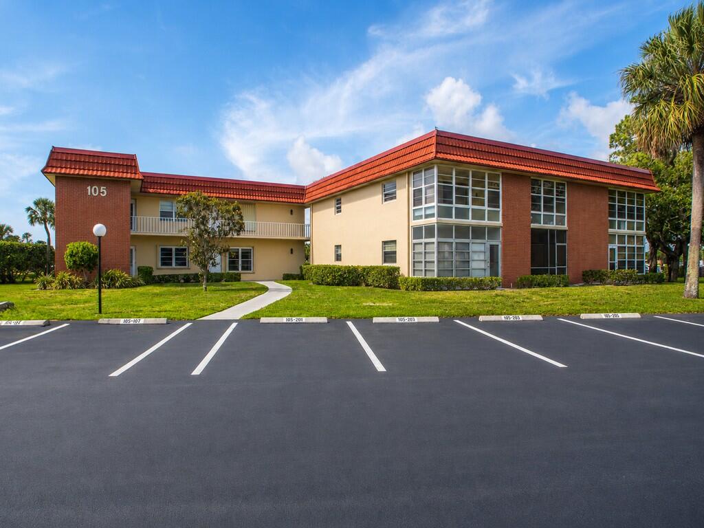 Love golf? 27 holes of golf meander through this active 55+ community w/ 4 clubhouses/heated pools, tennis, pickleball, bocce, shuffleboard, fitness/exercise rooms/social activities. Over 3 miles of private roads for biking/walking.  Located only 10 minutes from one of the Treasure Coasts "Best Voted Beaches." Lovingly maintained desirable 1st floor corner unit, serene garden views in the front, expansive golf course views in the back. Impact windows, accordion shutters, 2024 AC, 2024 HWH, 2021 Roof. Conveniently located to everything "Vero." Please note, 1 or more photos are virtually staged.