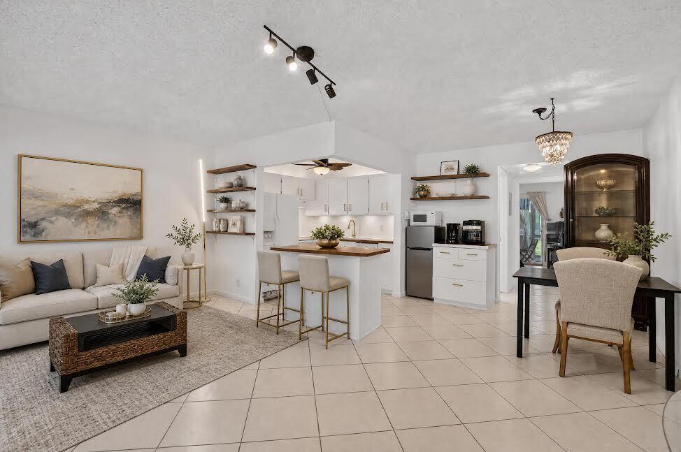 1-bedroom, 1.5-bath first-floor condo in a desirable Deerfield Beach retirement community. Offering 700 square feet of bright, inviting living space, this home features abundant natural light, fresh interior paint, updated ceiling fans, a new electrical panel, and a functional kitchen with a convenient island. Enjoy peaceful garden views from your living space, plus plenty of storage with both interior and exterior storage areas. Furniture is all yours, if you'd like... Making your move even easier. Residents enjoy an active lifestyle with a wide variety of community amenities,. This move-in-ready home offers comfort, convenience, and resort-style living!