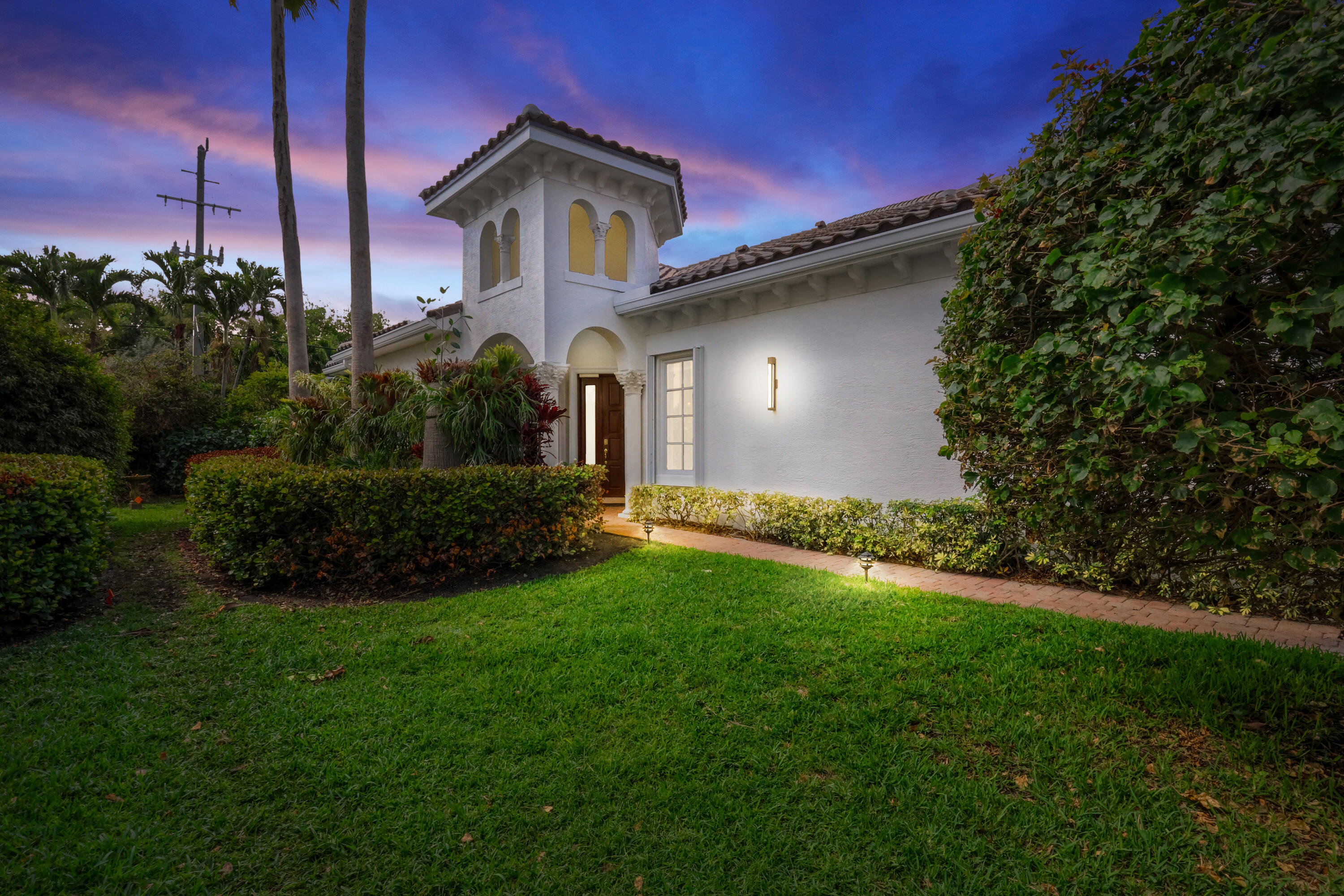 Hidden Gem in  Exclusive Renaissance Place North Palm Beach. Privacy and comfort of 1 floor living w/ private pool in a 3 bedroom & 3 full baths nestled in intimate gated enclave of just 15 homes. Tucked away on quiet 1 way street behind secure gates and walls, this hidden gem is close to shopping, fine dining, beaches and PBI airport. This home has 12' soaring ceilings and 10' graceful arches opening onto screened in covered lanai with renovated salt water pool w/spa. Luxurious engineered bamboo flooring and ceramic tiles create elegant and warm ambiance. Recent upgrades include: New Barrel tile roofs . New Lennox AC with humidistat and UV light.Interior upgrades. The chefs kitchen shines w/ stunning golden-hued tiles. Enjoy abundant storage in 2car garage Broten hurricane garage door plus attic space. Community recently upgraded to elegant European styled balconies, sophisticated outdoor lighting & neutral palette. This is Old World charm with contemporary appeal. Step outdoors to your private oasis: screened lanai enveloped in greenery around a travertine pool illuminated by dramatic lighting. Expansive primary w/ ensuite has French doors for seamless indoor to outdoor flow. 2nd bedroom is den and 3rd is  bespoke Library or convert to your vision. Bring your decorator and let inspiration flow. Open floor plan. Discover this treasure and create your new sanctuary.
