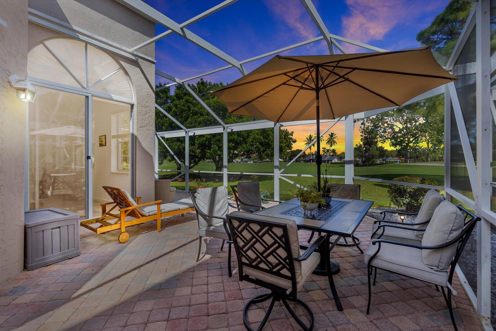 Impeccably maintained and move-in ready, this charming single-level home is located in the picturesque Villa D'Este neighborhood of PGA National. The light-filled interior features a spacious open layout with an updated kitchen, gas range, and dining nook. Enjoy outdoor living on the screened patio overlooking the fairway, perfectly positioned along the 17th hole of the Fazio Course with serene lake views. Villa D'Este offers a European-inspired setting with cobblestone streets, oak canopies, and a beautiful community pool. Furniture negotiable for a turnkey experience.