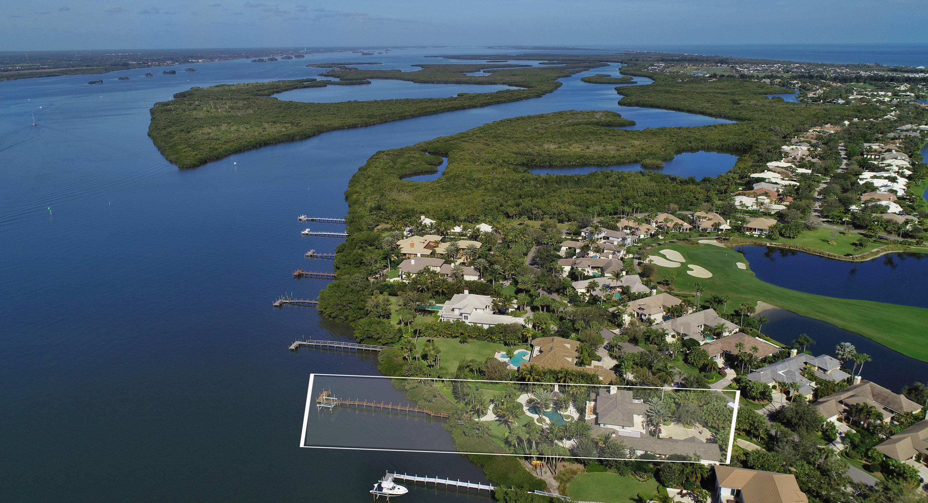 Exquisite riverfront estate w/private dock & direct Intracoastal access.  Architectural details thru-out w/high ceilings, wood & limestone floors.  4BR/6.5BA/Study, elegant DR w/hand painted mural, gourmet kitchen, projection room, pet room & fitness room.  Balcony off master overlooks river.  Tropical outdoor living area w/custom pool, stand alone cabana w/fireplace.  Sizes deemed reliable; subject to error.

One time initiation fee of $8K at closing.  All offers must include Comprehensive Addenda attachment.