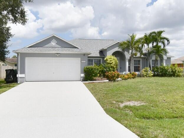 Beautifully maintained 3 bedroom 2 bath. Offers outstanding value in a quiet convenient Port St. Lucie neighborhood. The home features inviting formal living & dining areas, a modern kitchen with stainless steel appliances, granite countertops, oak cabinetry & a decorative backsplash, all opening to a spacious family room & breakfast nook. Enjoy the enclosed patio with slip resistant tile-perfect for year round relaxation. The generous primary suite includes a walk in closet, dual sinks, Roman tub & separate shower. Additional features include an inside laundry room, 2 car garage & ample storage. Ideally located minutes from I 95, the Turnpike & Tradition. New roof installed 3/22/23. Please submit proof of funds or pre-approval.
