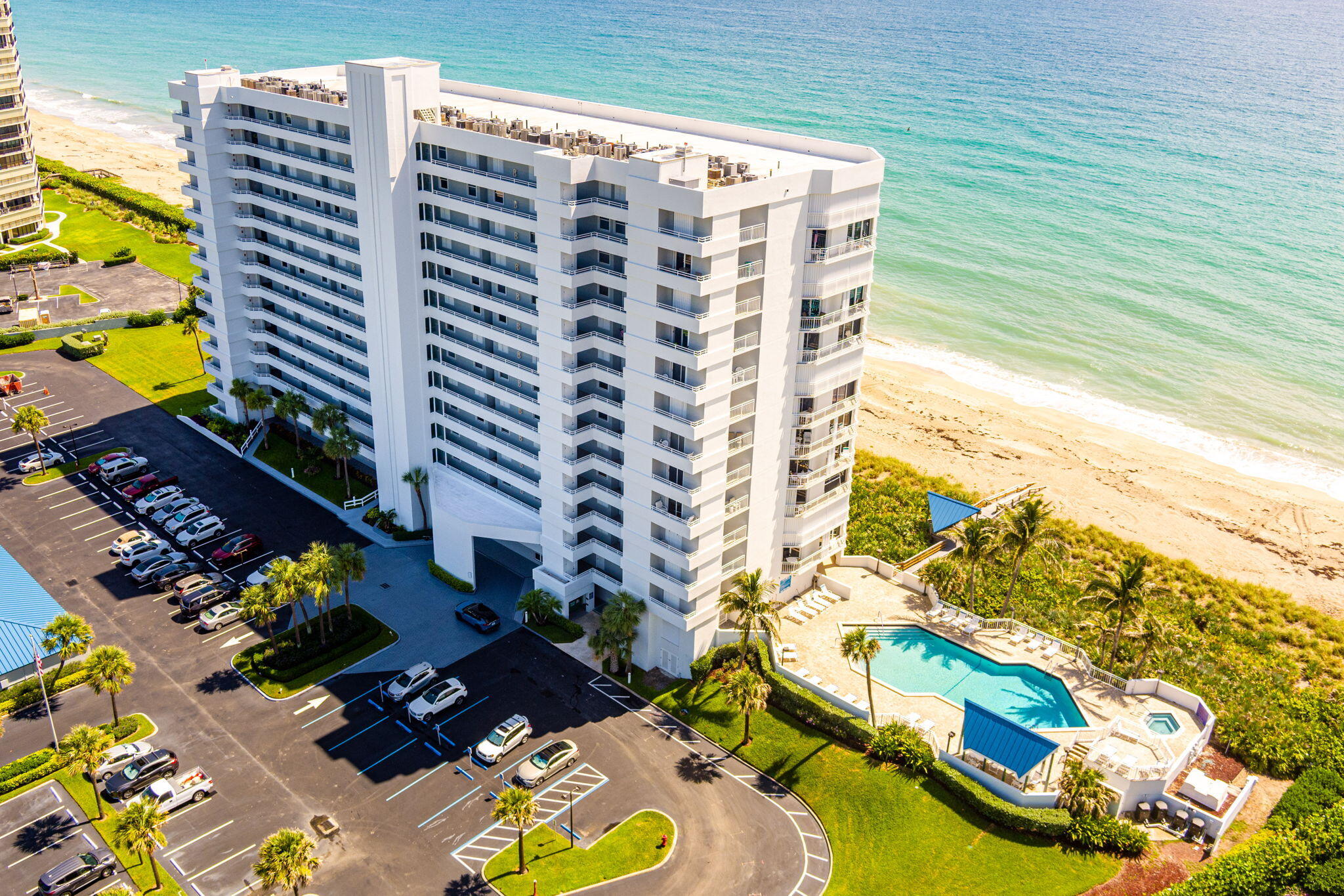 Experience elevated coastal living in this beautifully upgraded 2-bedroom, 2-bath oceanfront condo offering breathtaking ocean and city views. Enjoy stunning sunrises and even watch space shuttle launches from your private balcony. This residence features Level 5 finished walls and ceilings, crown molding throughout, and custom recessed lighting. The gourmet kitchen boasts custom all-wood shaker cabinets, river-washed granite countertops, GE Monogram appliances, induction cooktop, Liebherr panel refrigerator, Bosch paneled dishwasher, and wine fridge. Smart home upgrades include Ecobee Wi-Fi thermostat, Alexa switches, automated blinds, and Wi-Fi enabled water heater. New hurricane-impact sliders, windows, and front door complete this exceptional oceanfront residence.