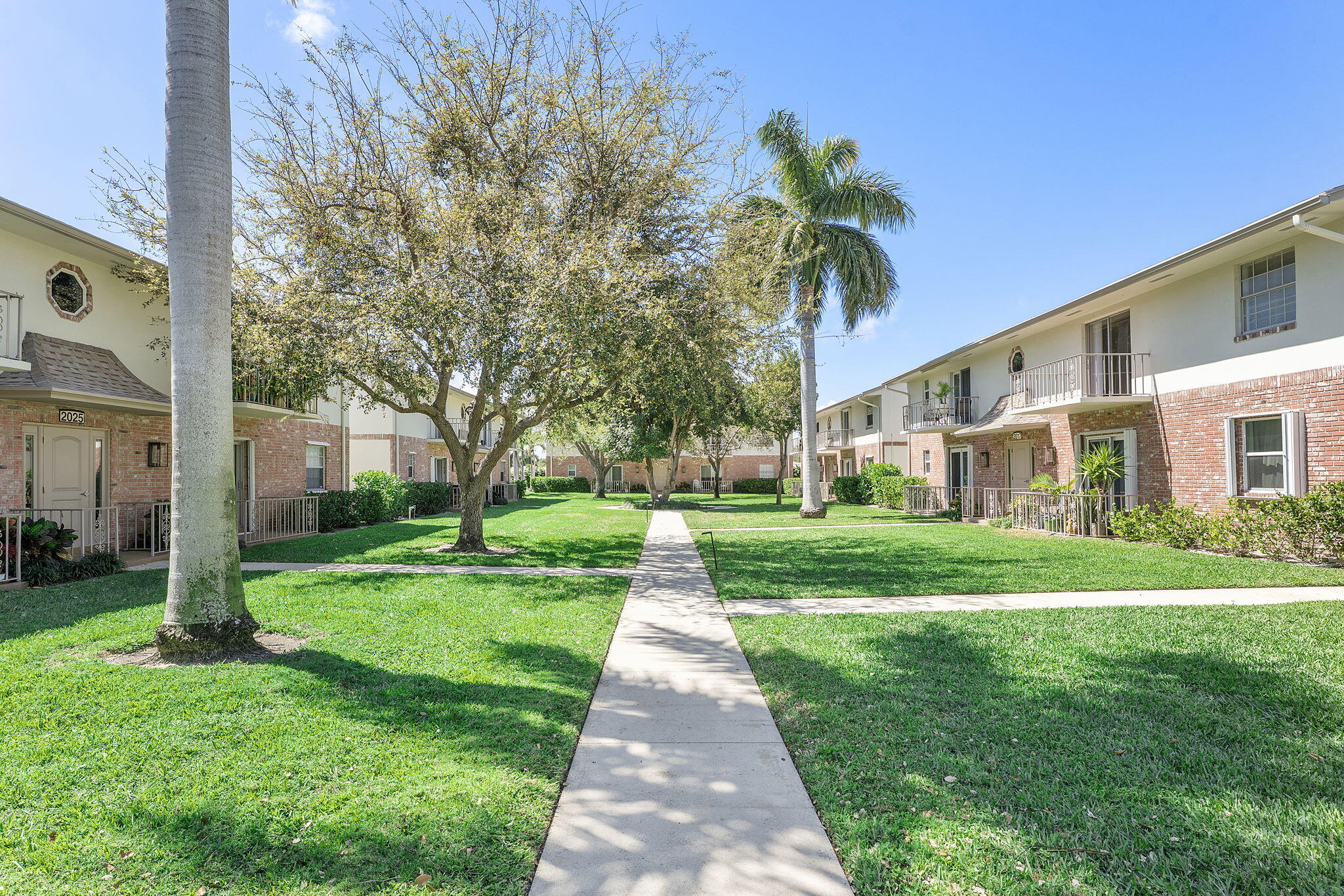 ALL AGE COMMUNITY, JUST MINUTES FROM THE BEACH, FULLY FURNISHED second-floor condo in the desirable Squire Hill community. This move-in-ready home boasts high-end stainless steel appliances, a new microwave, a recently installed A/C unit (January 2026), impact-resistant windows, a newer roof, and fresh exterior paint.  The bright interior features wood-look flooring, a coastal-inspired kitchen, and a private balcony with views of tropical grounds. Residents benefit from an all-inclusive association that covers water, building insurance, and amenities such as a pool, clubhouse, and updated laundry facilities ( no pending assessments). Conveniently located near I-95, beaches, top hospitals, and premier shopping, this turn-key residence is the ultimate Florida retreat.
