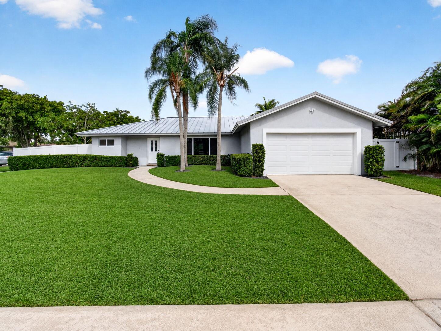 Welcome to this charming 3-bed, 2-bath single-story residence on oversized corner lot. The split bedroom plan offers 1,677 sqft of thoughtfully designed contemporary living space with open floor plan. The home boosts new kitchen with stainless appliances, quartz countertop, farmhouse sink, dry bar w/wine rack, ceramic plank tile throughout, and recessed lighting. The in-ground pool and covered patio make for fun backyard entertaining. BONUS for the boat enthusiast, this home comes equipped with a 15' x 30' boat pad with double swing, double hinge 12.5' gate. (Boat does not convey) Two-car garage offers attic access, shelving and hurricane garage door. 2025 NEW Metal Roof and NEW Pool Pump! 2022 Hurricane Impact (partial). A-rated school district. Easy access to I-95 and Turnpike.