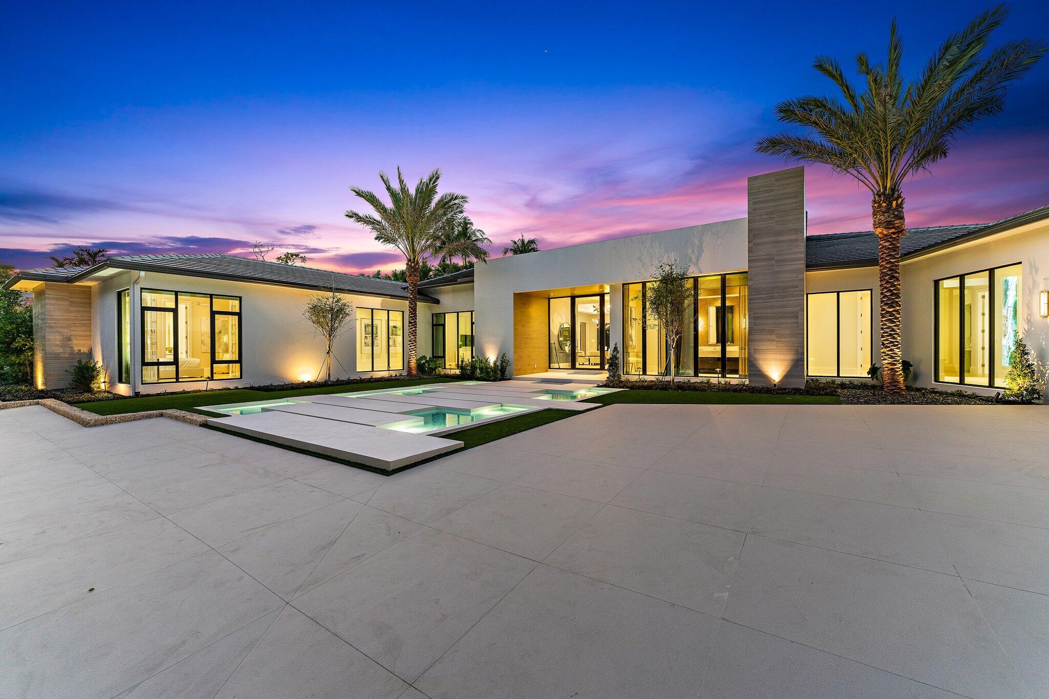 SEE SUPPLEMENTAL REMARKS FOR FULL DETAILS.... Newly constructed this stunning contemporary home offers incomparable luxury as the crème de la crème residence within the renowned Frenchman's Creek Beach & Country Club. Designed by award-winning Bloomfield Construction in conjunction with Affiniti Architects and FULLY FURNISHED & ACCESSORIZED - TURNKEY COMPLETED IN JAN 2023 by designer Terri Polimeni, this palatial residence features 5 bedrooms and 7 full baths and 1 half baths beautifully-executed custom plan with ultra-modern structural angles highlighting massive curb appeal. 
The Residence
Magnificent 16-foot ceilings span the fully-equipped kitchen and cozy living room area. Towering 10-foot doors separate these spaces from the gorgeous owner's suite which sports his & her baths fully stocked his and hers vanity and bathroom that will leave you wanting for nothing, not even a toothbrush, steam showers, and walk-in closets. At 10,279 total square feet the space also encompasses an office, state-of-the-art wine room for 616 bottles, a spacious dining area, homey recreational spaces like the club room outfitted with TVs, a bar, and a pool table with a view into the wine room all of which boast spectacular lake views. In addition, the home comes furnished with 9 flat-screen TVs and second to none Savant automation system. Not to mention the wealth of cutting-edge appliances in the kitchen built with a true entertainer's vision, with not just one, but two massive islands set in the forefront of custom cabinetry, Wolf range top & dual ovens, double dishwashers and Subzero refrigeration including a coffee station with cup warmer, central vacuuming and 3 tankless water heaters. Heating and cooling can be centrally controlled to achieve the perfect temperature throughout while modern and stylish impact windows help to keep the desired atmosphere in and unwanted noise out.
The Outdoors
Find the ultimate entertainment and outdoor living space under a 2,100 sq. ft. covered lanai with automated phantom screening, a summer kitchen, sit down bar and appliances with BBQ and pizza oven. You can also find expertly manicured estate style lush green space to further compliment the modern esthetic,  40x44 infinity-edge pool, a relaxing private spa, spacious conversation areas and a fire table. Come home to a wealth of world-class amenities and pull into your gated circuar driveway w/ upgradeable air conditioned 4 car plus golf cart garage with power for electric vehicle (EV) charging stations, and 11-foot ceilings to accommodate up to 4 additional car lifts.
The Neighborhood
Settle into the premier lifestyle community in South Florida Frenchman's Creek Beach & Country Club. Resort-style amenities and a world-class professional staff make residing in the vicinity an unmatched experience. Whatever your preferences, you can find them here, every day of the year. Residents enjoy unreserved access to a variety of dining venues, recreational facilities, signature events, and social activities with a private beach club and exclusive oceanside amenities in nearby Juno Beach. Enjoy our renowned 36 holes or drive your golf cart to The Bear's Club or Trump National Golf Course Jupiter for more world class golf.
 The coast is calling. Move in and explore this one-of-a-kind lifestyle for yourself.
Square footages and sizes are approximate.