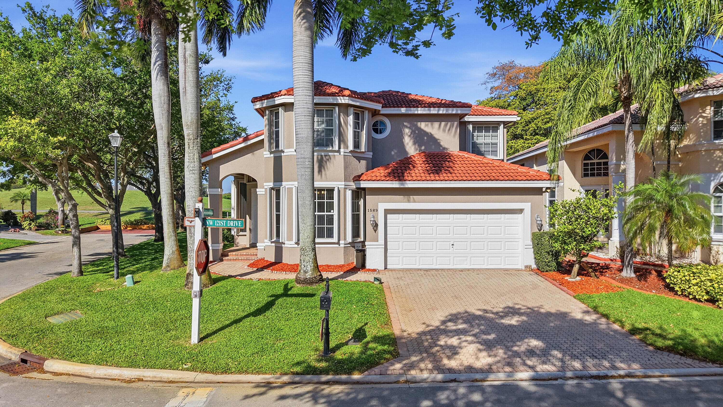Experience unparalleled luxury in this 5BR/4BA Turnberry model, perfectly positioned on an oversized corner lot along the 18th hole of Eagle Trace golf course. Enjoy breathtaking sunset views from your screened oasis featuring a pristine pool, covered lanai, and retractable awning. Inside, dramatic volume ceilings elevate the formal living and dining spaces. The kitchen boasts stainless steel appliances & opens to a spacious family room. The layout offers a lavish primary suite and versatile 2nd bed/office on the main level, plus 3 bedrooms & a loft upstairs. Includes an additional private parking space! Upgrades: 2023 roof, RainSoft water system, tankless water heater, and accordion shutters. Guard-gated HOA offers tennis, pickleball, fitness and clubhouse. Easy access to I-75 & airports.