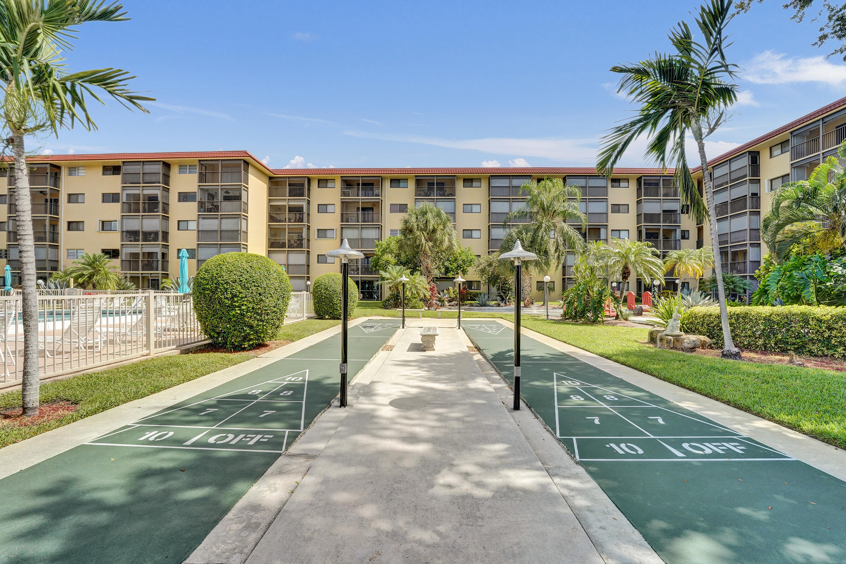 Welcome to this 2 bedroom, 2 bath condo located in a well maintained 55+ community in vibrant Pompano Beach. This is a wonderful opportunity to update and remodel the unit to reflect your own personal style and taste. Relax on the screened in balcony overlooking the beautifully landscaped garden and pool area. Located just minutes from the beach, shopping, restaurants, golf courses, and pickleball. Enjoy a beautifully maintained pool, community room, fitness area, and the convenience of a laundry facility located on the same floor as the unit. No leasing is permitted, making this an ideal community for full-time or seasonal residents seeking a quiet, owner occupied environment.