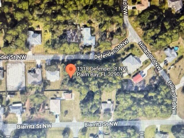 Rare opportunity to own 1/2 acre double lot . To be sold along with 1318 Defender NW as one transaction. located near St Jons Parkway just north of Malabar road.