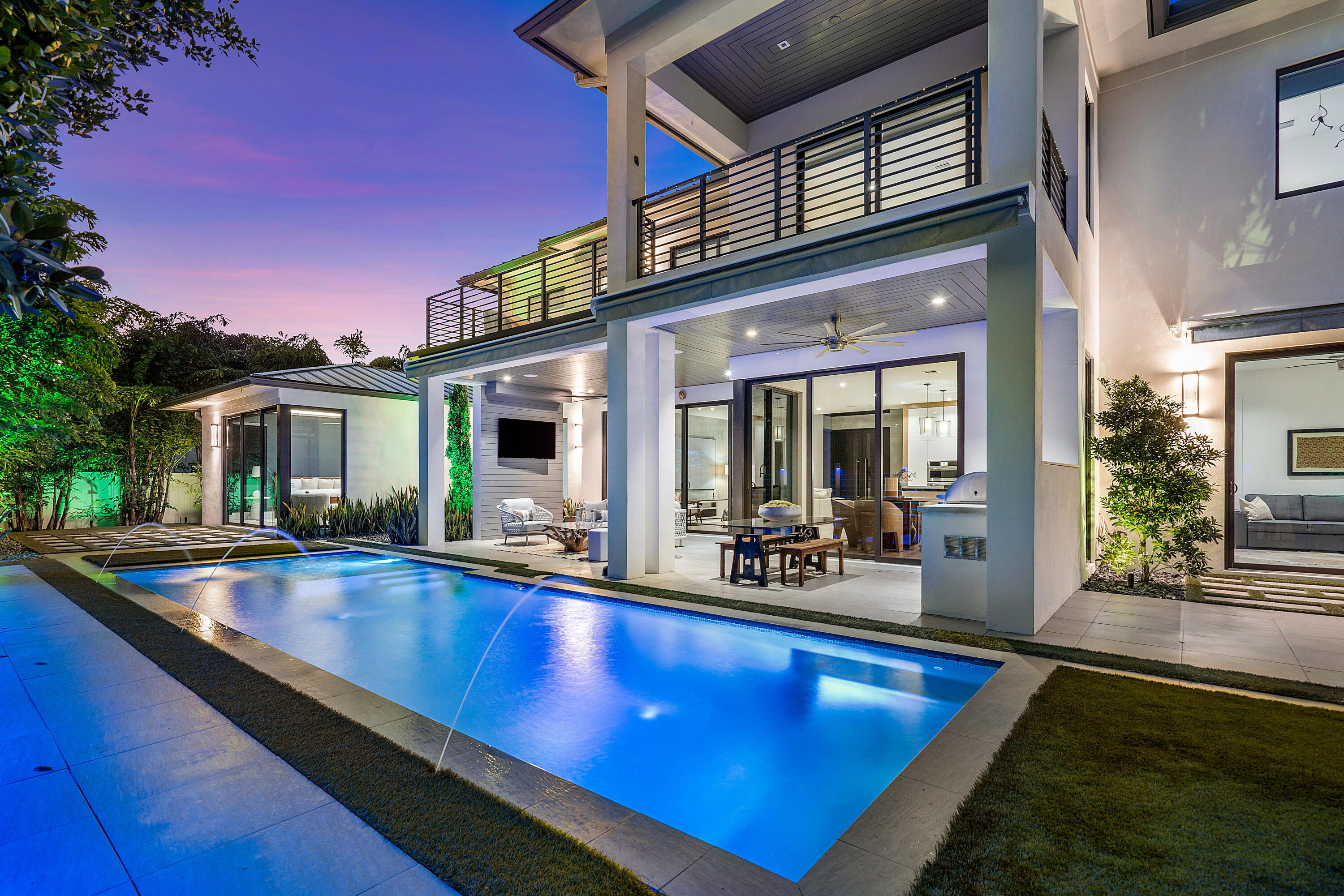 Wake up each morning wrapped in luxury in this newly built coastal modern masterpiece by Bella Homes on a private cul-de-sac lot in the enviable neighborhood of Lake Ida. This 5 bedroom, 5.1 bathroom home provides the perfect backdrop for the multitude of memories you'll make in it. Every inch is dedicated to enjoyment of this impeccably planned oasis. Masterfully crafted with superb attention to detail, this home is luxury defined. Entering through the volumous, two-story glass foyer, you'll be drawn to the Bella Citta eco-friendly wood floors and allow the brilliant natural light that flows through floor to ceiling windows wash over you. Natural touches make their way through the home's 3,869 square foot open floor plan, where hints of wood, glass, and stone can be found throughout. The custom designed modern kitchen features a beautiful reclaimed wood and stone island that changes colors at the touch of a button. In addition to clean lines and modern finishes, a Jenn-Air appliance package, ample storage, and a spacious walk-in pantry make this home the perfect spot for casual living and gracious entertaining.

A wall of impact glass sliding doors trace the back wall of the home's first floor, seamlessly blurring the lines between interior and exterior. Dine inside or al fresco beneath the inviting covered patio that features a summer kitchen and luxurious resort style pool. Automated awnings on both levels provide additional shade to enjoy your lush private oasis with constant ocean breezes. You can even work on your golf game in the 6-hole putting green or workout in the covered outdoor gym space.

The first floor master suite with lush tropical garden views is an owner's dream with his and hers walk-in closets, sliders to a private patio, and a light and bright, spacious master bathroom. An office/5th bedroom with private ensuite bathroom is on the first floor as well and has gorgeous views of the backyard. The second level has 3 additional bedrooms all with private ensuite bathrooms and provide ample space for family members and guests. The loft provides an upstairs family room with an extensive second outdoor space with a balcony for viewing and enjoying sunsets.

Built in 2019, this home features expansive modern amenities including a whole house generator, whole house water filter system, Control 4 smart home remote, security cameras, Sonos surround both inside and out, an alarm system and much more.

This expansive home full of architectural charm is in the Lake Ida community and is just a short bike or golf cart ride away from Atlantic Avenue, Pineapple Grove, and the Beach!

The information published and provided including but not limited to prices, measurements, square footages, lot sizes, features, finishes, and calculations are subject to errors, omissions or changes without notice. All such information should be independently verified. All parties should perform their own due diligence to verify all information.