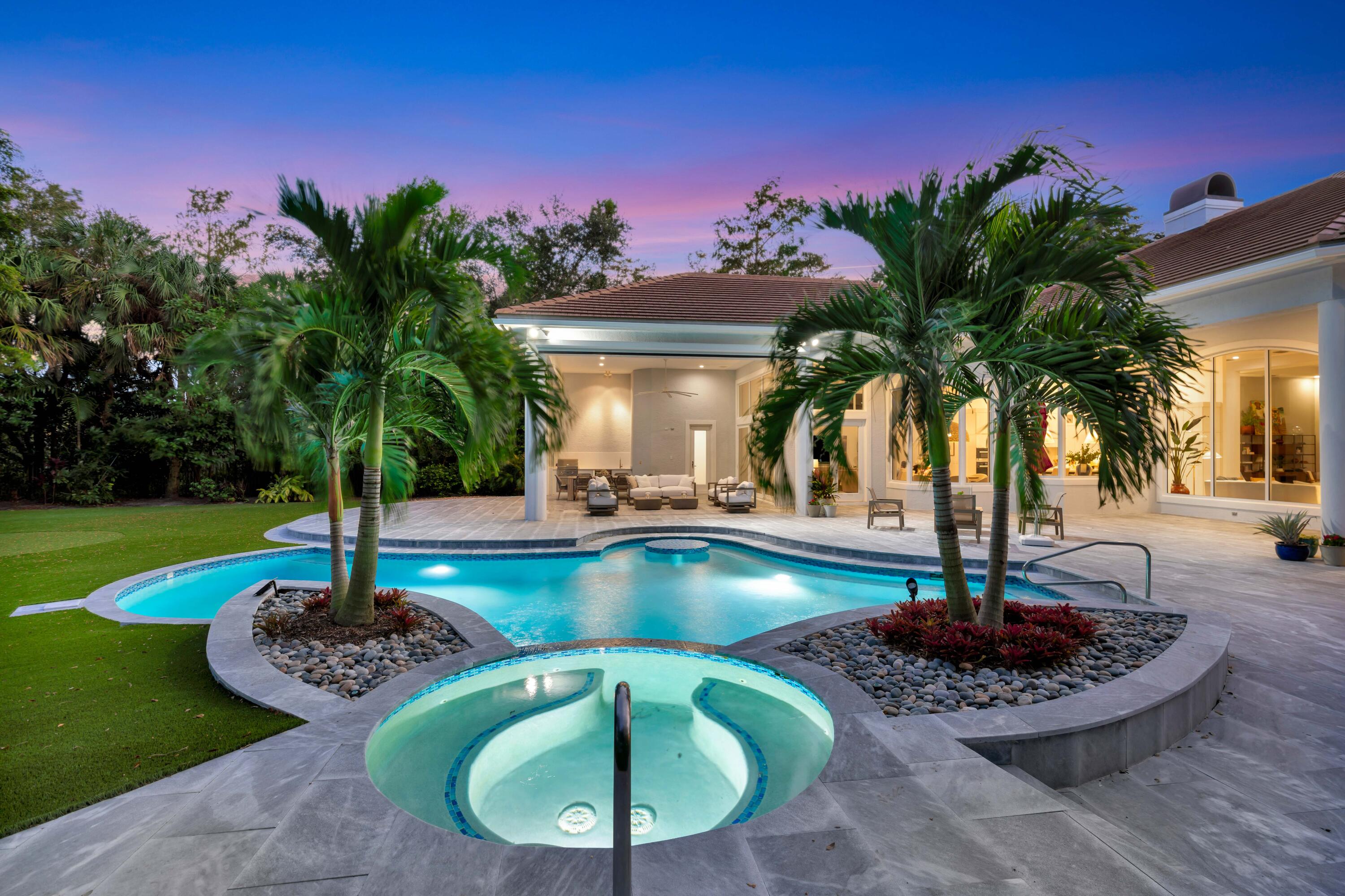 Discover refined living in the exclusive gated golf community of Old Marsh. Perfectly positioned on ¾ of an acre with stunning eastern-facing views, this 5,000 sq. ft., 4-bedroom residence has been fully renovated and move-in ready.  Step inside to fresh new flooring that creates a warm California-inspired vibe, while outdoors, a brand-new summer kitchen with phantom screens sets the stage for effortless entertaining. The home's private setting is enhanced by preserve on one side and lush tropical landscaping throughout, creating a serene retreat.  Enjoy the convenience of a low-maintenance artificial turf yard complete with a putting green, perfect for both fun and relaxation.  As a resident of Old Marsh Golf Club, you'll experience one of South Florida's most coveted - more...