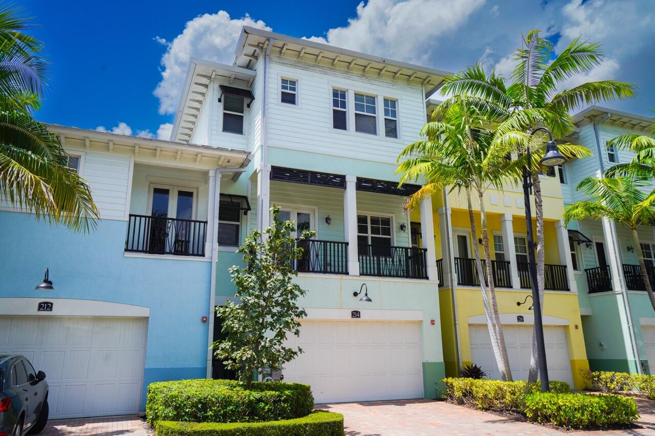Tenant occupied through 8/31. Experience luxury living in Latitude, a coastal community! This exceptional townhouse boasts a stunning, newly remodeled kitchen and modernized bathrooms. Sunlight streams through the impact glass windows, highlighting the freshly renovated interior with its 10-ft high ceilings and elegant hardwood floors. Entertain effortlessly on the patio or unwind on the balconies. Park with ease in the 2-car garage. Indulge in resort-style amenities like a sparkling pool, clubhouse, putting green, and playground. With Boca Schools zoning, it's perfect for families. Just minutes away from Delray Beach's vibrant downtown and breathtaking beaches, plus an array of restaurants and shopping centers. Embrace the pinnacle of luxury living here!