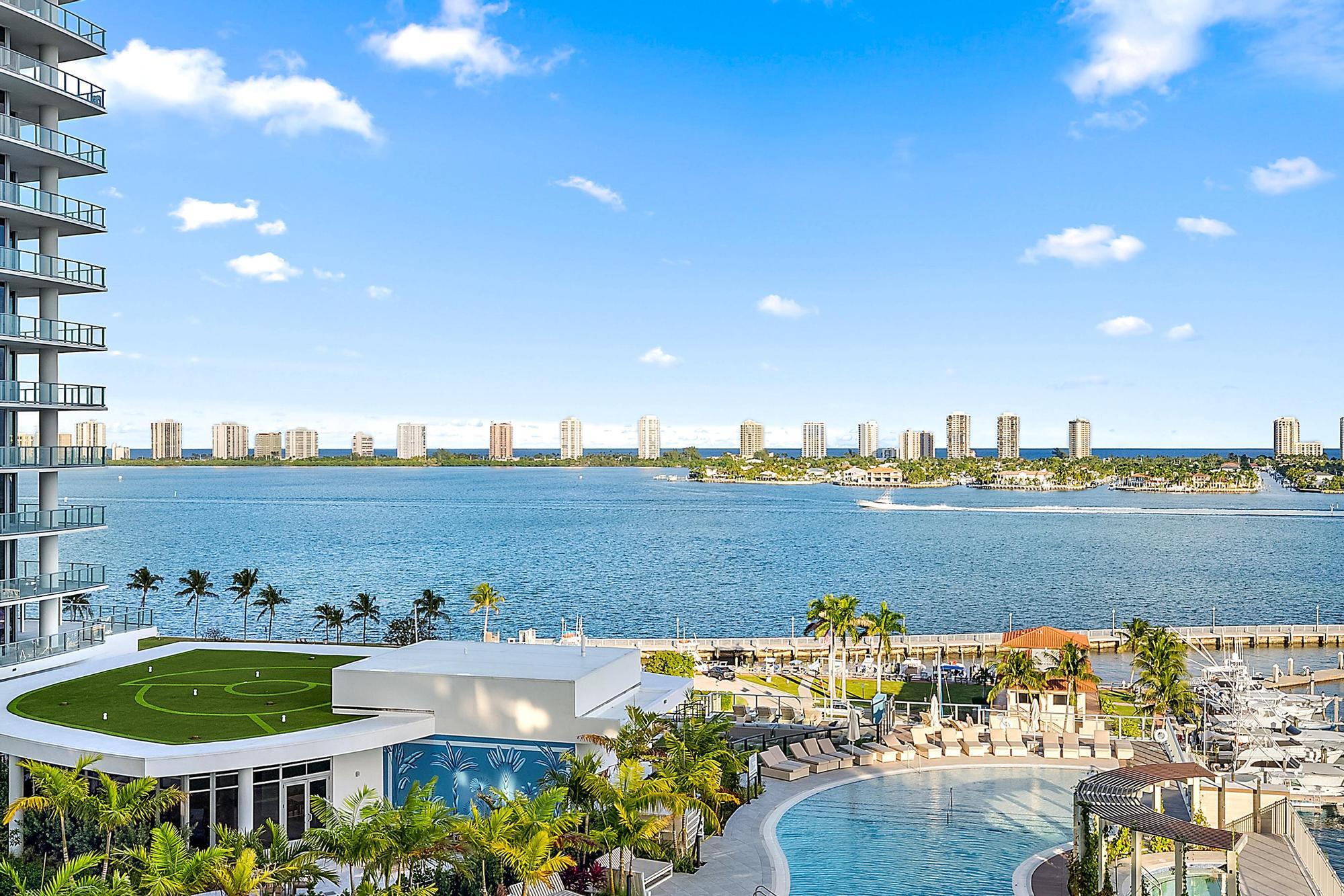 High-floor residence at Nautilus 220 offering rare dual water views of both the Intracoastal and Atlantic. Positioned within Lake Park's emerging marina corridor just north of Downtown Palm Beach, this newly built 3BR/3.5BA plus den sits within one of Palm Beach County's most exciting waterfront districts, with new investment, dining, marina activity, and a planned walkable mixed-use center nearby. Interiors by Stephen G include floor-to-ceiling glass, Miele appliances, integrated motorized shades, and high-end European finishes. Designed for effortless waterfront living with the flexibility today's sophisticated buyers are increasingly seeking, residents also enjoy a private marina and resort-style amenities rarely found in one building. Amenities at Nautilus 220 rival a private waterfront resort. A sprawling one-acre amenity deck features a pool, spa, fire pits, putting green, yoga lawn, and dog park, complemented by a club room, cinema, golf simulator, valet, and 24-hour concierge. Wellness and recreation continue indoors with a spin studio, billiards and card lounge, kids' playroom, and teen gaming space. The rooftop lap pool and spa offer panoramic views spanning the Intracoastal and Atlantic. Additional conveniences include 24-hour security, on-site management, electric vehicle charging, and private marina access. Waterfront dining, boutique retail, office space, and a café are seamlessly integrated into the community, creating a walkable waterfront environment where every detail is designed for effortless luxury living.