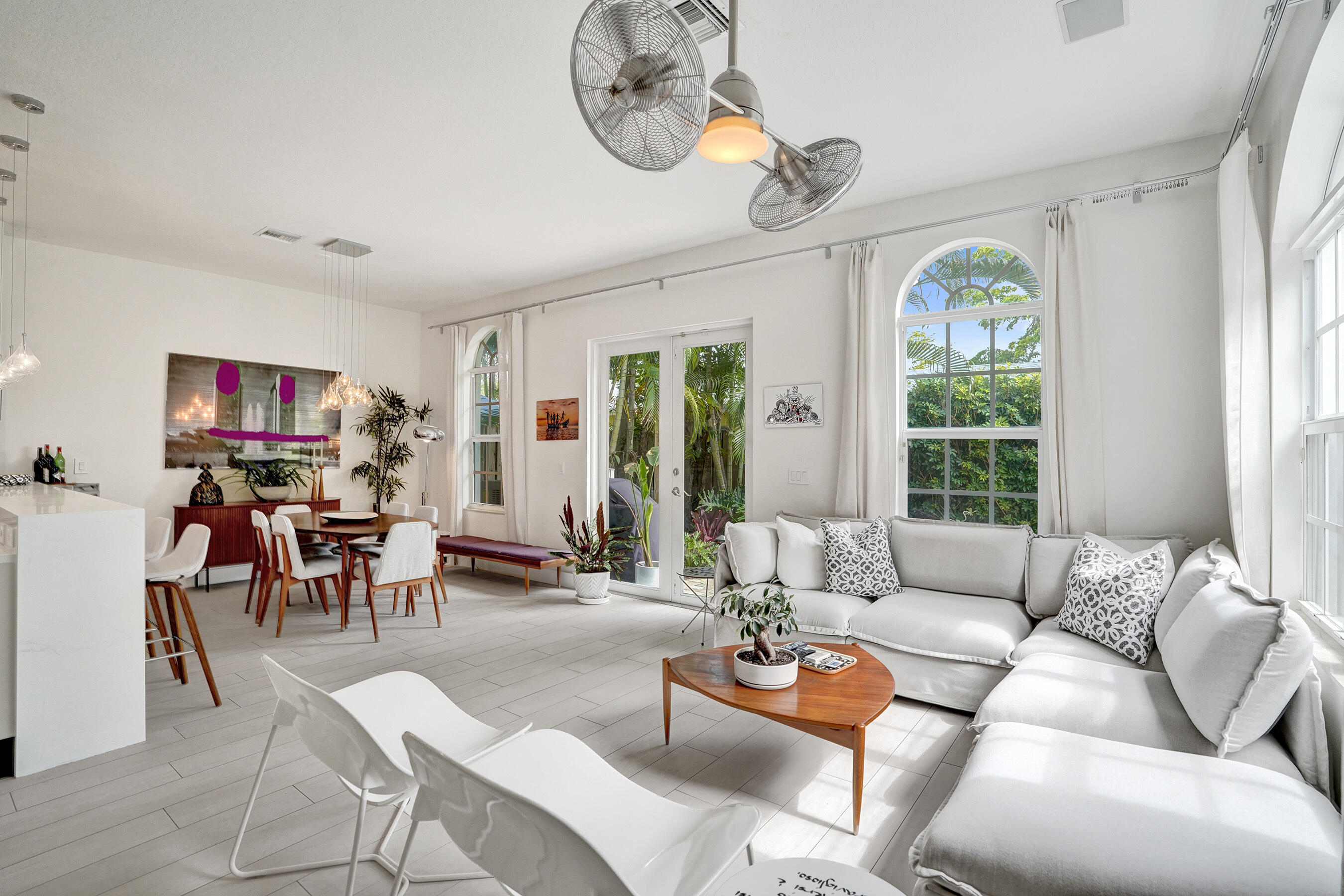 Charming corner townhouse in the heart of Wilton Manors, walking distance from restaurants, nightlife, and entertainment of Wilton Drive. This 3 bed/2.5 bath home offers 1,944 sq ft living space, 10-ft ceilings, abundant natural light, and a rare total of 4 parking spaces inc a 2-car attached garage with EV connection. The home features a heated pool, outdoor shower, impact windows and doors, metal roof, sprinkler system, and new landscaping. Renovated kitchen (2024) with quartz countertops, refaced cabinetry, stainless steel appliances, and new microwave. Primary bathroom renovated in 2024 and guest bathroom 2021. European tile flooring  2021, large washer/dryer, and A/C replaced in 2022 with warranty. HOA $500 quarterly and includes roof repairs. A beautiful home in a fabulous location.