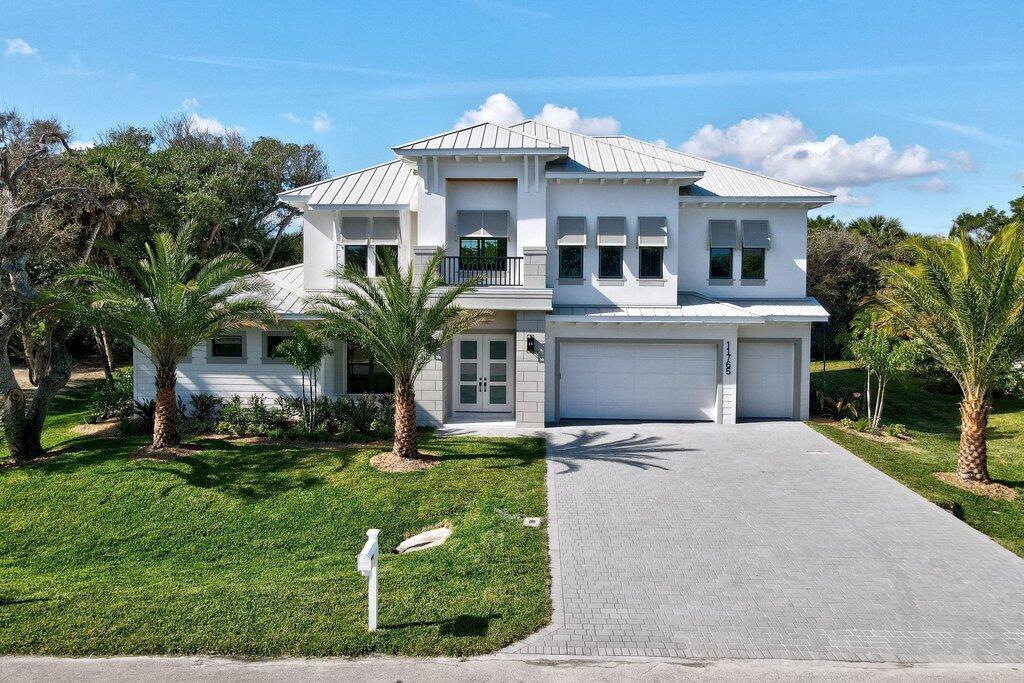 COASTAL LUXURY LIVING JUST STEPS TO THE OCEAN. LOCATED JUST NORTH OF WABASSO BEACH IN A SERENE CUL-DE-SAC. THIS STUNNING 2 STORY RESIDENCE OFFERS NEARLY 4,000 SQ. FT. OF REFINED COASTAL LIVING. DESIGNED FOR PRIVACY, COMFORT & ELEGANCE. THIS EQUISITE HOME BLENDS TIMELESS CRAFTMANSHIP & MODERN AMENITIES. 4/4.5/3 W/POOL/SPA. PRIMARY SUITE IS CONVENIENTLY ON THE FIRST FLOOR. 3 SPACIOUS GUEST BEDROOMS & PRIVATE UPSTAIRS LIBRARY & LOFT PROVIDE COMFORTABLE SEPARATION & SPACE. SHOWCASING EXCEPTIONAL MILLWORK INC. CROWN MOLDING & ARCHITECTURAL DETAILS THROUGHOUT.