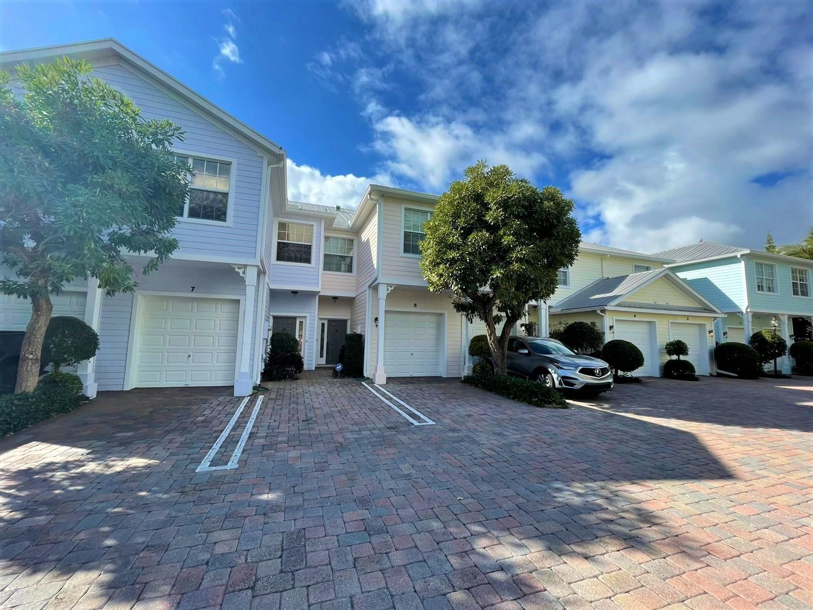 Live close to the beach in this beautiful Key West-style 3BR/2.5BA/1CG townhome solid CBS construction with metal roofs in Pineapple Village South. Perfect as a primary residence or an investment property. The kitchen features wood cabinets, pantry, granite countertops, and brand new stainless steel refrigerator and stove. Enjoy peace of mind with impact windows in the bedrooms. Upgraded bathrooms, ceramic tile throughout the first floor (and even the garage), bamboo flooring on the stairs and upstairs hallway, central vacuum system. Plantation shutters throughout add a clean, stylish touch. Pineapple Village South is ideally located near downtown Lake Worth, the Intracoastal, and just minutes to the beaches and nearby park. It can be rented yearly at once after closing! It can be rented at once after closing. Only 2 cars and 2 pets (each 80lb max) allowed. HOA requires 10% down payment for loans.