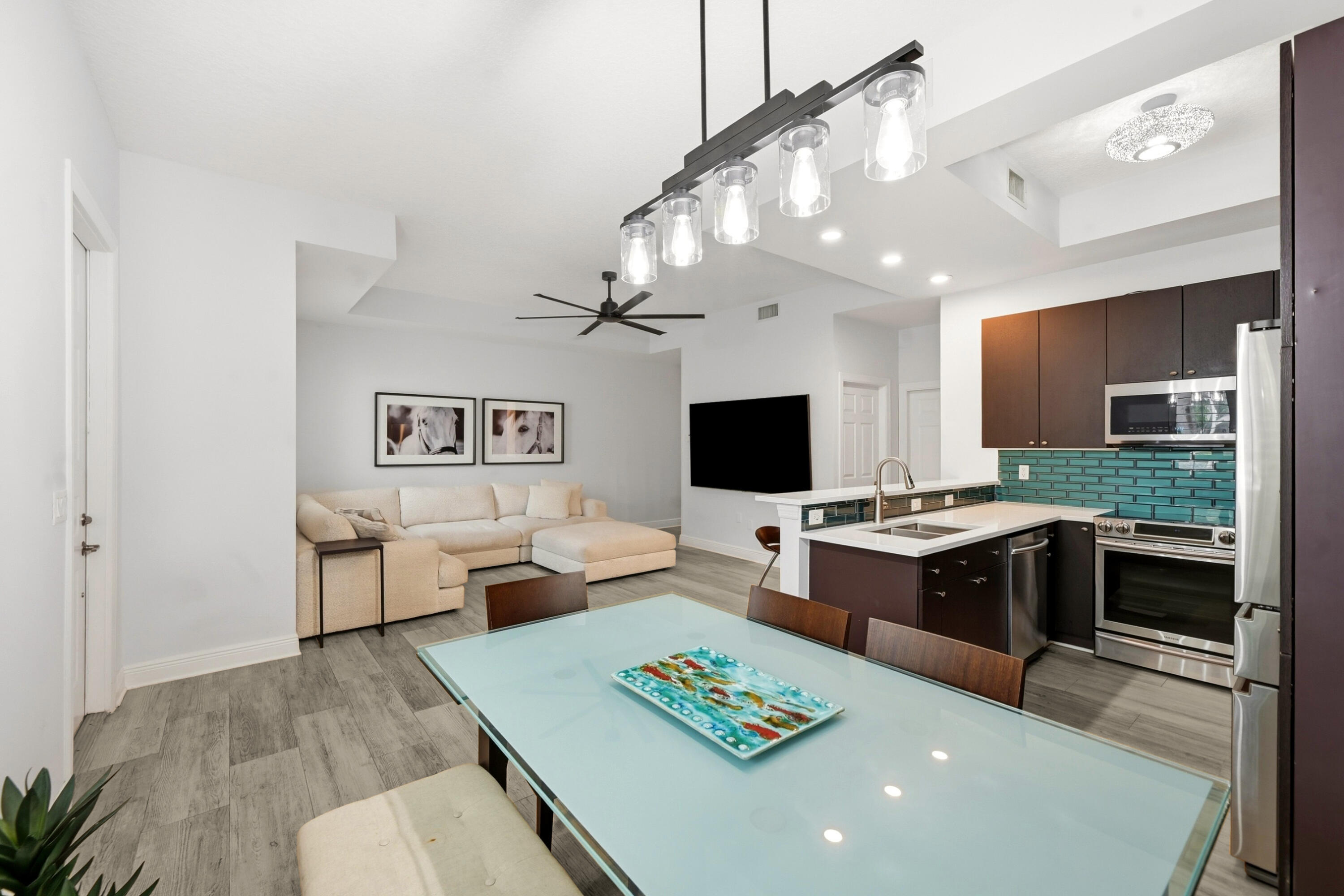 Nestled in the vibrant heart of Lake Worth Beach, this spacious three-bedroom, 2.5-bathroom townhome offers a masterclass in modern luxury. A recent, meticulous renovation brings sophisticated finishes to every corner of the property. The main floor welcomes you with an airy, open-concept layout grounded by elegant plank-style tile flooring. At its center is a gourmet chef's kitchen featuring premium quartz countertops, a sleek subway tile backsplash, and stainless steel appliances. The upper level features updated flooring throughout the bedrooms, highlighted by a magnificent primary suite. This sanctuary features two walk-in closets with custom built-ins and an exquisite bathroom completely transformed. Whole House water purification, Plantation shutters, Impact Windows & Tesla Charger Centrally located, 10 minutes to Palm Beach International Airport and Downtown West Palm Beach, 20 minutes to Atlantic Avenue in Delray. Minutes to shopping, golf courses and pristine beaches.