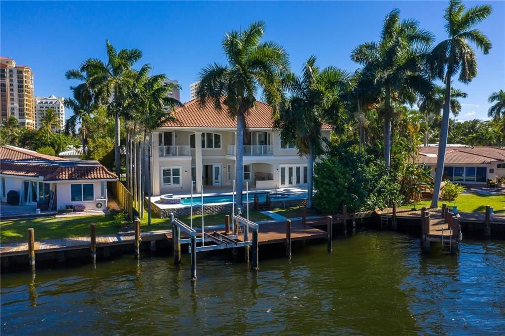 Exquisite intracoastal views from this Mediterranean classy, just minutes away from the beach. This retreat sits on large lot, w/65’ directly on the intracoastal, in a desirable neighborhood with private access to Hugh Taylor Birch State Park. A 2015 construction, this home was built to last, featuring 5 very generous bedrms, all en-suite. It has countless impact windows, trayed ceilings, jetted tubs, double vanities and walking closets. Plantation shutters discretely filter the soothing light, allowing for relaxing living and entertaining spaces. Enjoy comfort and convenience with the use of the elevator, two laundry rms and 2 garages. The backyard has it all: sparkling heated pool, hot tub, cabana full bathrm, outdoor kitchen, sun-drench entertaining area and ravishing wide water views.