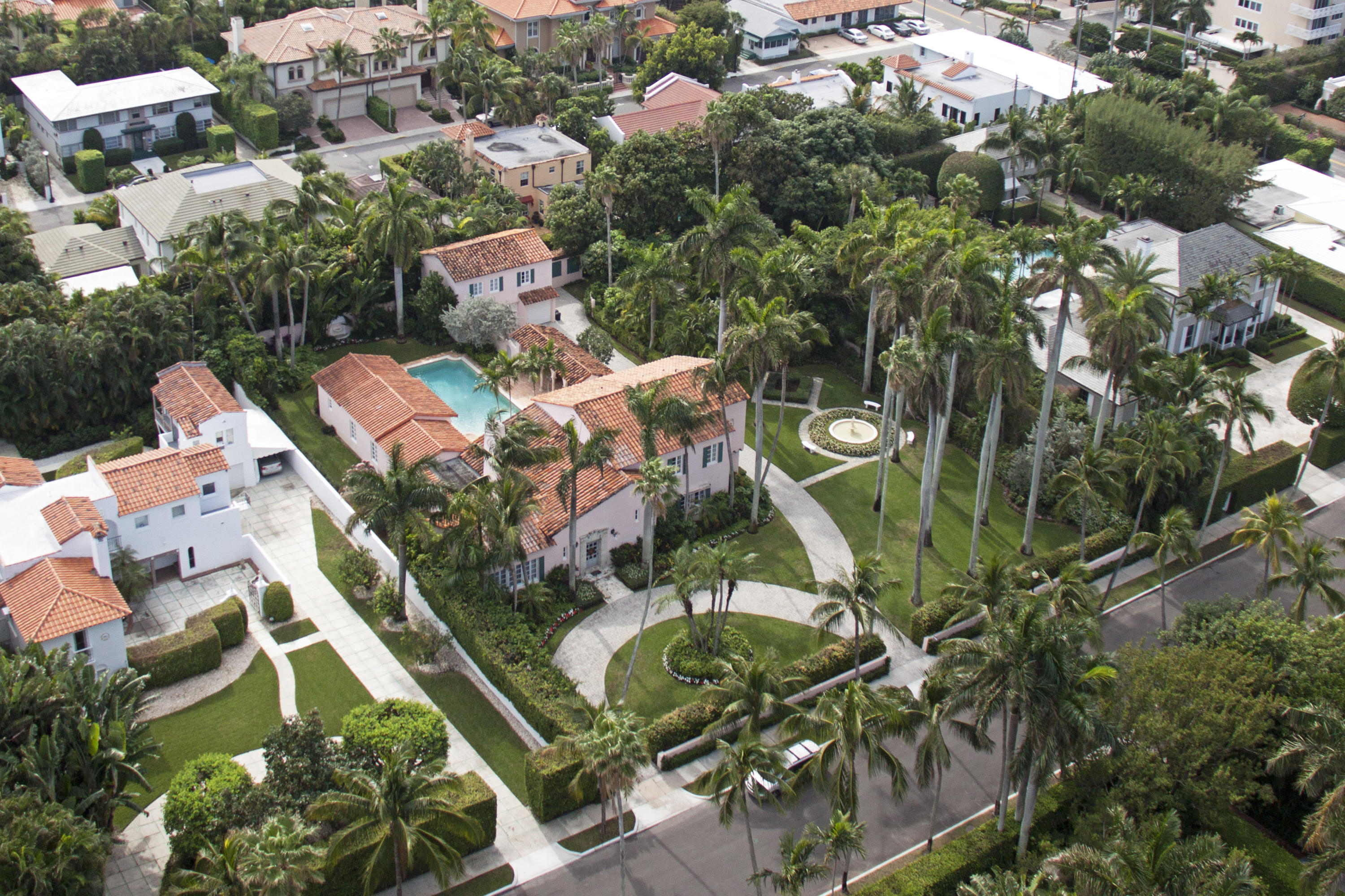 Elegant 5BR/5.1BA Mediterranean on oversized 29,400 +/- In-Town lot. Estate features guest apartment, soaring pecky cypress ceilings, and 2 car garage. Beautiful grounds with formal garden, 20 Royal Palms, fountains, 40 ft. pool and loggia. Move in, remodel, or reimagine and build new.