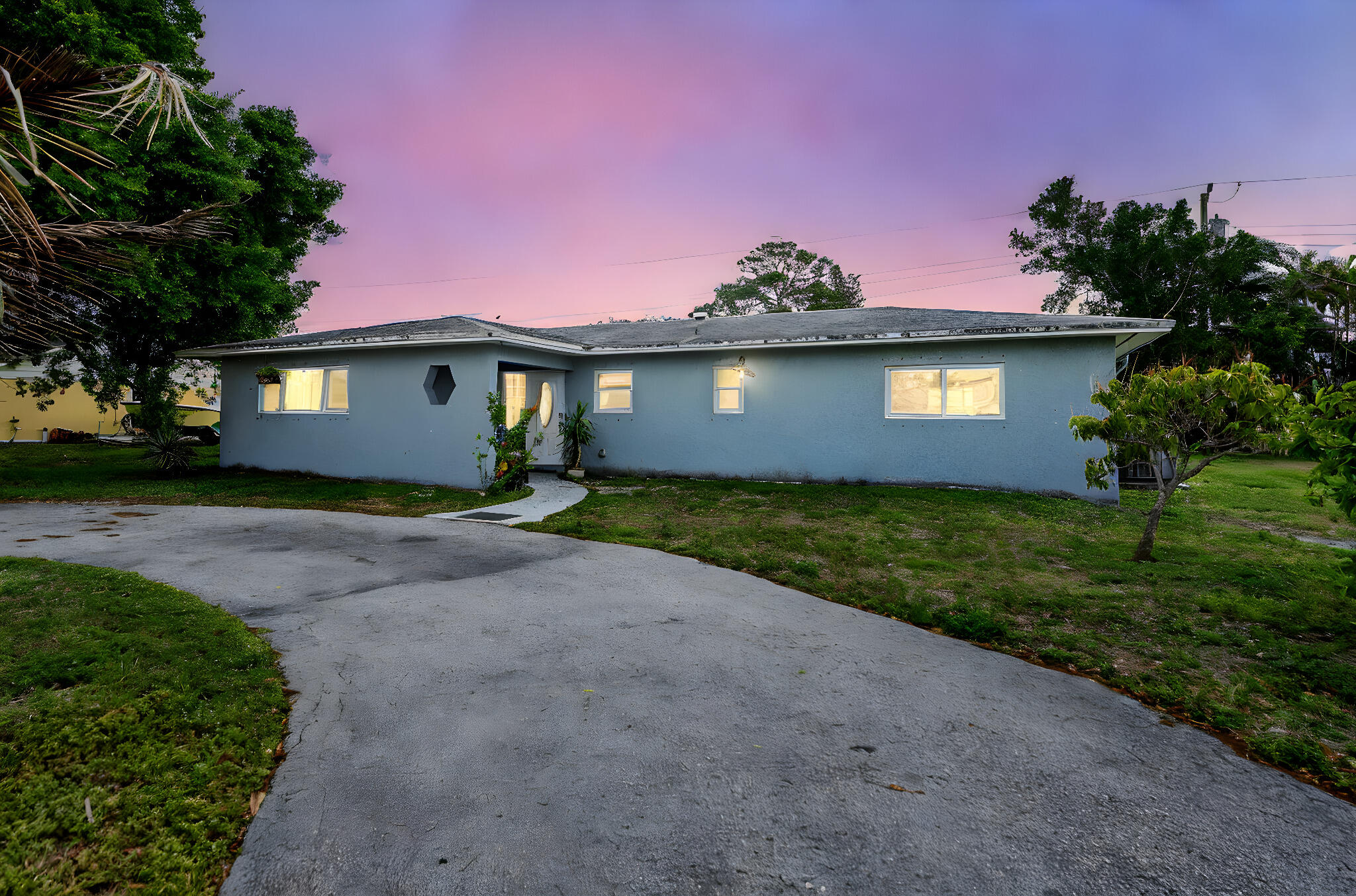 This well-maintained 5-bedroom, 3-bathroom home offers 2,245 square feet of flexible living space on a generous 0.28-acre lot. With 5 rooms, great for multigenerational living or seasonal use, the property features two primary suites and designed for comfort and privacy. Recent updates include a 2019 roof, impact windows (2023), water heater (2024), and new flooring in bedrooms (2025), providing peace of mind for years to come!  Conveniently located near Mall of Wellington Green, Grand Champions Polo Club, local preserves, and a variety of dining options, this home offers both lifestyle and accessibility in one of Palm Beach County's most desirable areas.