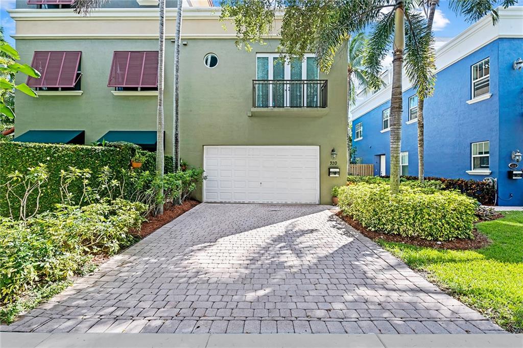 Exceptional location and elegance meet at this fee-simple Victoria Park townhouse. No HOA and walking distance to Las Olas Blvd. The first floor greets you with high ceilings, travertine flooring, and French doors leading out to the fenced and private yard with lush tropical landscaping. A large kitchen with gas range and walk-in pantry, dining area, and great living room round out the first floor. Laundry and three total bedrooms are on the second floor. The spacious master suite features an en-suite bath and his & hers walk-in closets. The third floor features a large open loft, with a full bathroom and closet, which could be converted into a 4th bedroom. French doors lead out to the rooftop terrace. Integrated B&W speakers throughout most of the homes interior and exterior.