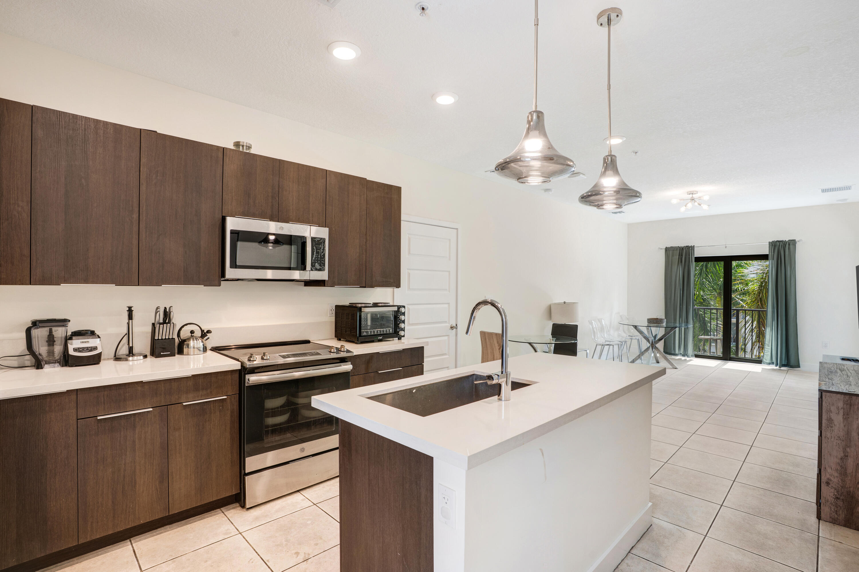 Experience modern living in the heart of Downtown Doral! This beautifully maintained residence offers an open-concept layout, natural light, a modern kitchen and the convenience of an in unit washer and dryer.  Enjoy access to resort style amenities, including a swimming pool, state of the art fitness center, clubhouse, indoor basketball court, children's play area, and more. Ideally located within walking distance to Downtown Doral's premier restaurants, cafés, shops, parks, and entertainment, with easy access to major highways, Miami International Airport, and top-rated schools. Live where convenience meets lifestyle in one of Doral's most sought after communities. Schedule your private tour today