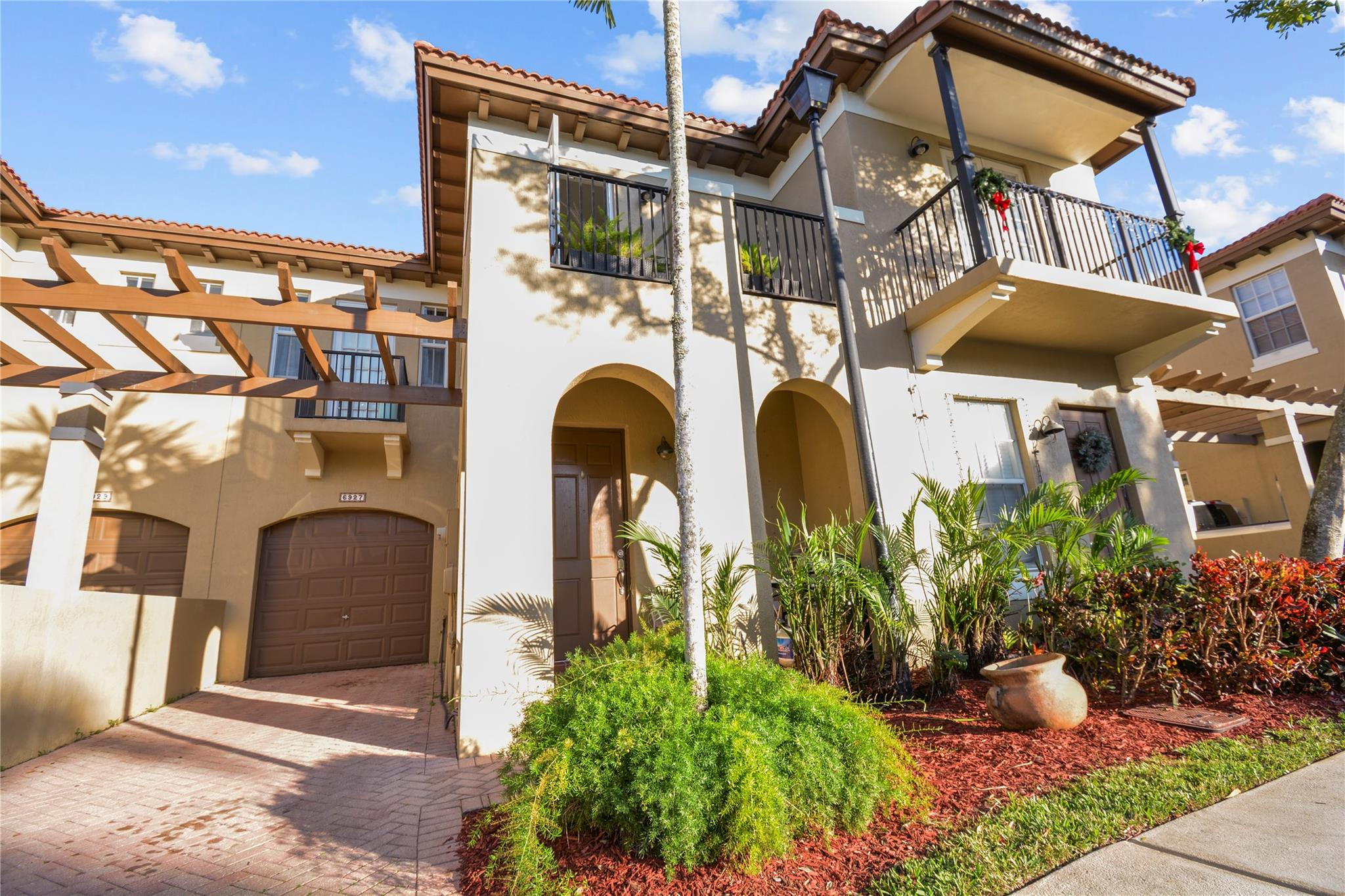 Major price adjustment! Beautifully refreshed 3BED/2.5BATH townhouse in the hidden gated community of Julia Gardens, w/ a spacious master suite, private balcony, impact-resistant windows, new water heater, & 1car garage. Brand new interior paint & updated cabinet hardware creates a clean, modern aesthetic throughout. This turn-key home is move-in ready & offered furnished/unfurnished for added flexibility. The private backyard offers a serene setting for outdoor entertaining or quiet relaxation. Ideally located near upscale shopping, dining, & the Beaches. Situated in a highly desirable school district, featuring one of the lowest HOA fees in town.  An exceptional family & pet-friendly neighborhood in a prime location.