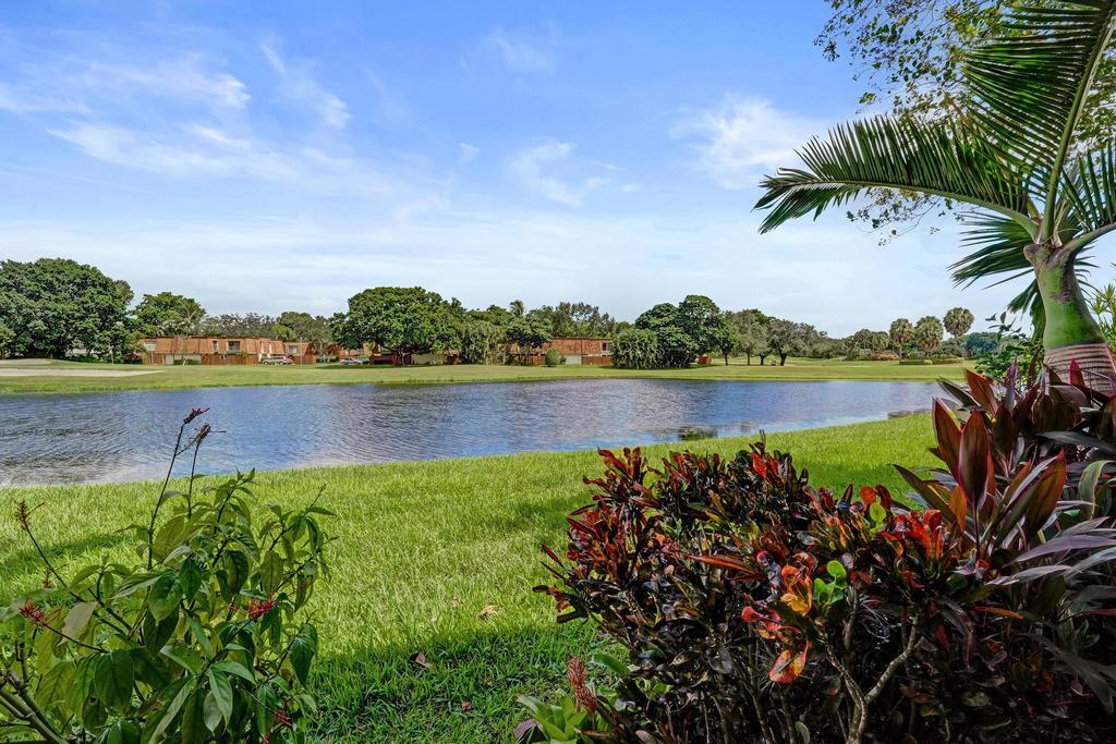 THE BEST ! WOW FACTOR GALORE!! SPACIOUS 2 BEDROOM 2 BATH CONDO WITH THE BEST GOLF & WATER VIEWS IN PINE ISLAND RIDGE CC! COMPLETELY UPGRADED/UPDATED 1ST FLOOR CORNER APARTMENT *STEPS TO PARKING* THE SPACIOUS KITCHEN STUNS WITH THOMASVILLE CABINETRY * EUROPEAN GRANITE & ADDED PANTRY *UPGRADED GE PROFILE STAINLESS STEEL APPLIANCES* ALL BATHS ARE UPGRADED*1/4 TURN SS VALES THROUGHOUT* GORGEOUS 24" RECIFIED ITALIAN PORCELAIN TILES THROUGHOUT* 5 INCH CUSTOM BASEBOARDS* ALL IMPACT GLASS WINDOWS & SLIDERS UPGRADED THICKNESS TO "7/16"*INTERIOR DOORS HAVE OBSURED GLASS INSERTS* CEILINGS HAVE KNOCK DOWM FINISH* PLANTATION BLINDS-"SHUTTER SMART" 4 YEAR OLD YORK AC WITH UV LIGHT*NEW ROOF 2024* 75" SONY TV INCLIDED! COUNTRY CLUB-GOLF COURSE*TENNIS*GYM* SORTS BAR*POOL*PICKLE BALL* CONDO FOR ESA RULES*