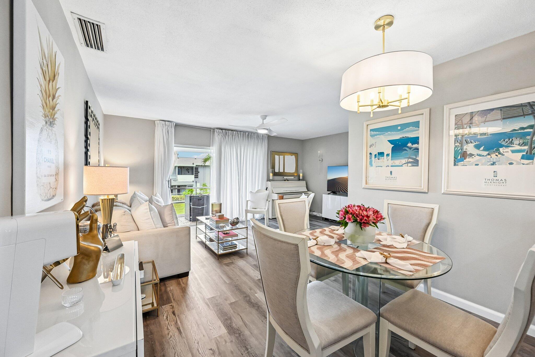 Welcome to this beautifully remodeled 1-bedroom, 1.5-bath condo offering an unbeatable South Florida lifestyle in a boutique 98-unit community. Thoughtfully updated from top to bottom, this move-in-ready condo showcases new flooring throughout, a beautifully remodeled kitchen featuring white cabinetry, granite countertops, and a full suite of brand-new appliances. Additional recent improvements include a new A/C system (2026), a new electrical breaker panel (2026), a new roof (2022), new interior & exterior doors, and hurricane shutters for added peace of mind and storm protection. The open-concept layout creates a bright and inviting living space perfect for everyday living and entertaining. Relax on your private screened patio overlooking peaceful, tropical garden views, the perfect spot for morning coffee or evening cocktails. The spacious primary suite offers a full wall of closet space and a private en-suite bath, while the additional half bath provides added convenience for guests. Most furnishings are negotiable separately, making this an excellent turnkey opportunity.  The community has recently undergone an exterior transformation with fresh paint and updates that enhance its curb appeal and welcoming atmosphere. Residents enjoy a clubhouse with a fitness center, sparkling community pool, and beautifully maintained grounds.  Location is everything, and this one truly delivers. Just minutes from the award-winning beaches, vibrant Atlantic Avenue in Delray Beach, Downtown Boca Raton, world-class dining, shopping, golf, and entertainment, you'll have everything South Florida has to offer right at your fingertips. Whether you're searching for a full-time residence, seasonal getaway, or investment opportunity, this beautifully upgraded condo offers incredible value in one of the area's most desirable locations.