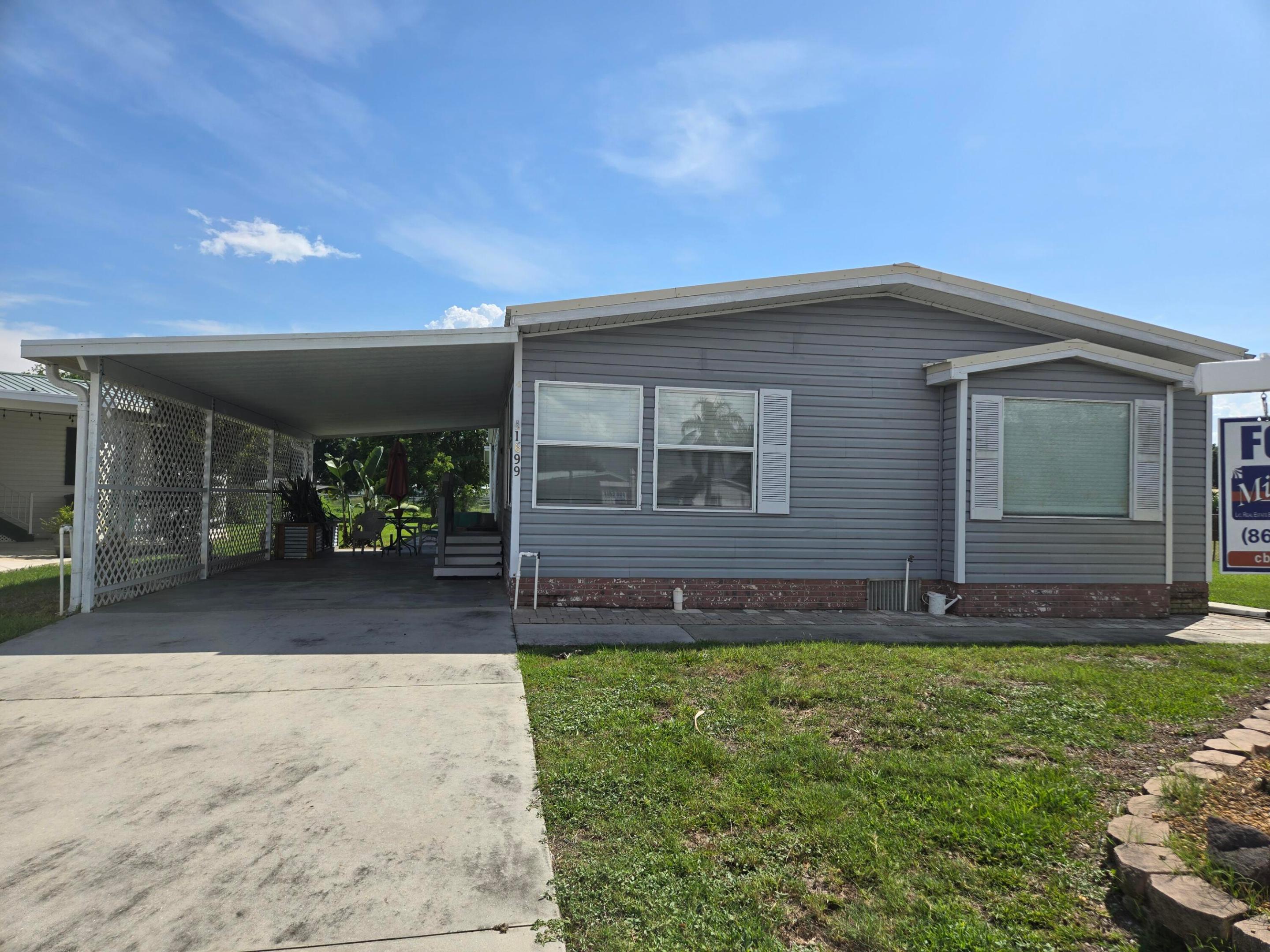 Welcome to this 3-bedroom, 2-bathroom manufactured home located in Seminole Cove Condominium in Okeechobee, Florida. Offering 1,793 square feet of finished living space on one story, this single-level residence provides convenient and practical living. The thoughtful floor plan accommodates multiple bedrooms and bathrooms, making efficient use of the available space. This property in Seminole Cove Condominium presents a solid opportunity for those seeking an affordable residential option in the Okeechobee area.