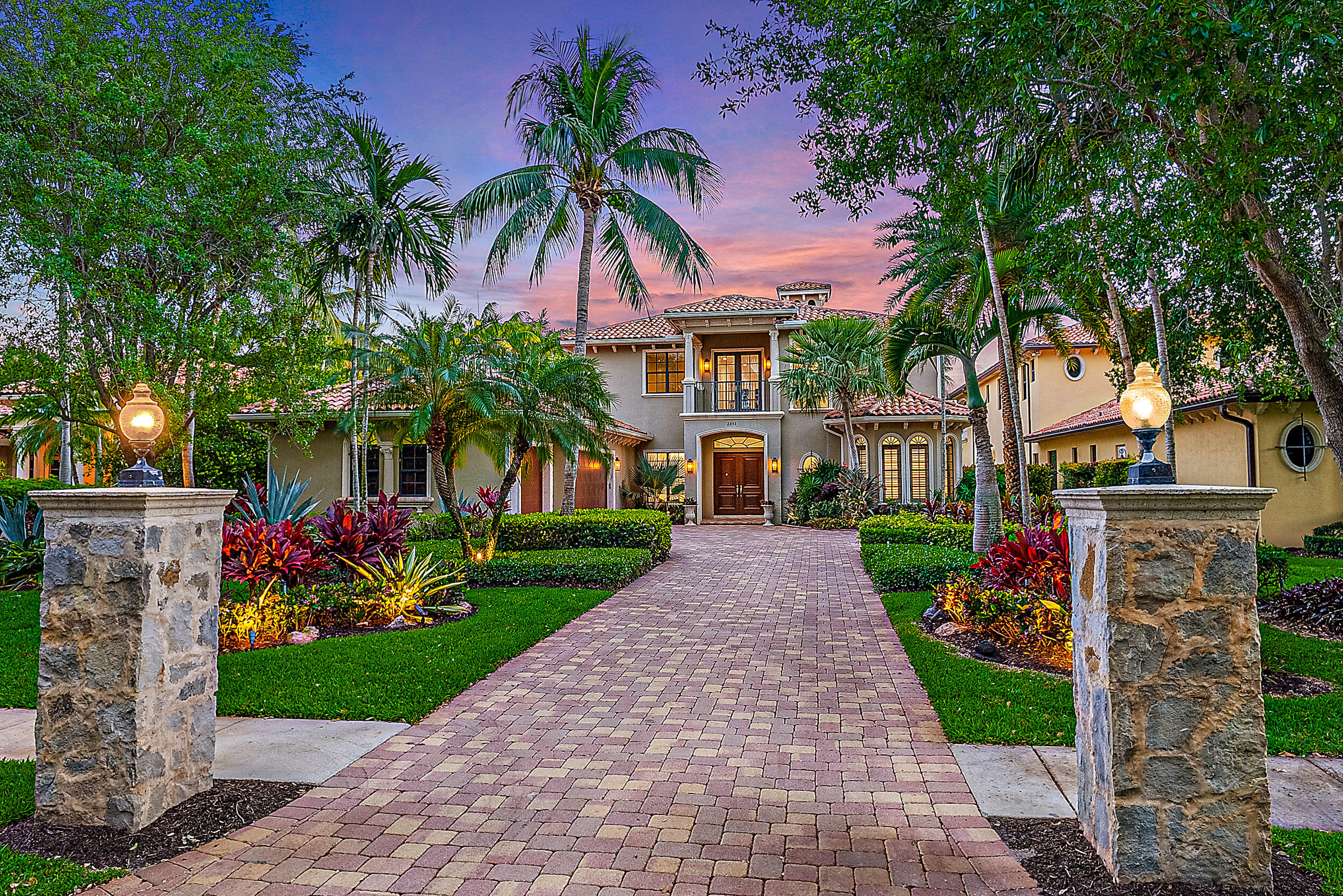 EXQUISITE OPPORTUNITY to own a Newly Renovated Home in one of Palm Beach Gardens' most treasured locations! 'The Cove' is a gated enclave of only 20 Waterfront homes along the coveted Donald Ross corridor. This modern + elegant home is sits on almost 1/2 acre of Beautiful grounds with no homes across the street. A grand driveway leads to a spacious 3 Car garage. Opulent entry boasts double height ceiling, floor to ceiling windows + stunning honed marble flooring in the formal living room. This exceptional floor plan offers abundant living + entertaining space. 2022/23 Design Upgrades include: - new hardwood flooring in family room, kitchen - modern chef's kitchen, 2023 - newly painted interiors - new luxury bathrooms - new pool equipment - all new wiring for audio + speakers ... Downstairs primary bedroom suite is private + spacious and includes a morning bar, dual custom closets, a large office (or gym) + a spa bath. Additional main floor living includes formal living room, dining area, TWO family rooms + kitchen w/ breakfast nook. Upper level offers a generous loft w/ balcony and 3 additional bedrooms with ensuite baths. The outdoor living area is SPECTACULAR! A covered lanai with summer kitchen overlooks the tropical pool area, landscaped to perfection. Full Home GENERATOR. The chic outdoor cabana bath was recently completed. This South facing tropical Oasis offers several seating/gathering areas and is quiet + serene. A gated walkway leads to your private dock, along 76' of scenic Florida water frontage. The Cove's HOA is exceptional, managing the common areas, front and back lawn, pest control and weekly pool maintenance. Private dock for up to 30' boat. For larger boats, there are two deepwater marinas within walking distance! This enclave is a rare find - close to world class beaches, shopping and dining as well as sport, educational and cultural venues. Twenty minutes to the Palm Beach International Airport and Palm Beach Island. Truly a wonderful place to enjoy the finest in Florida Living!