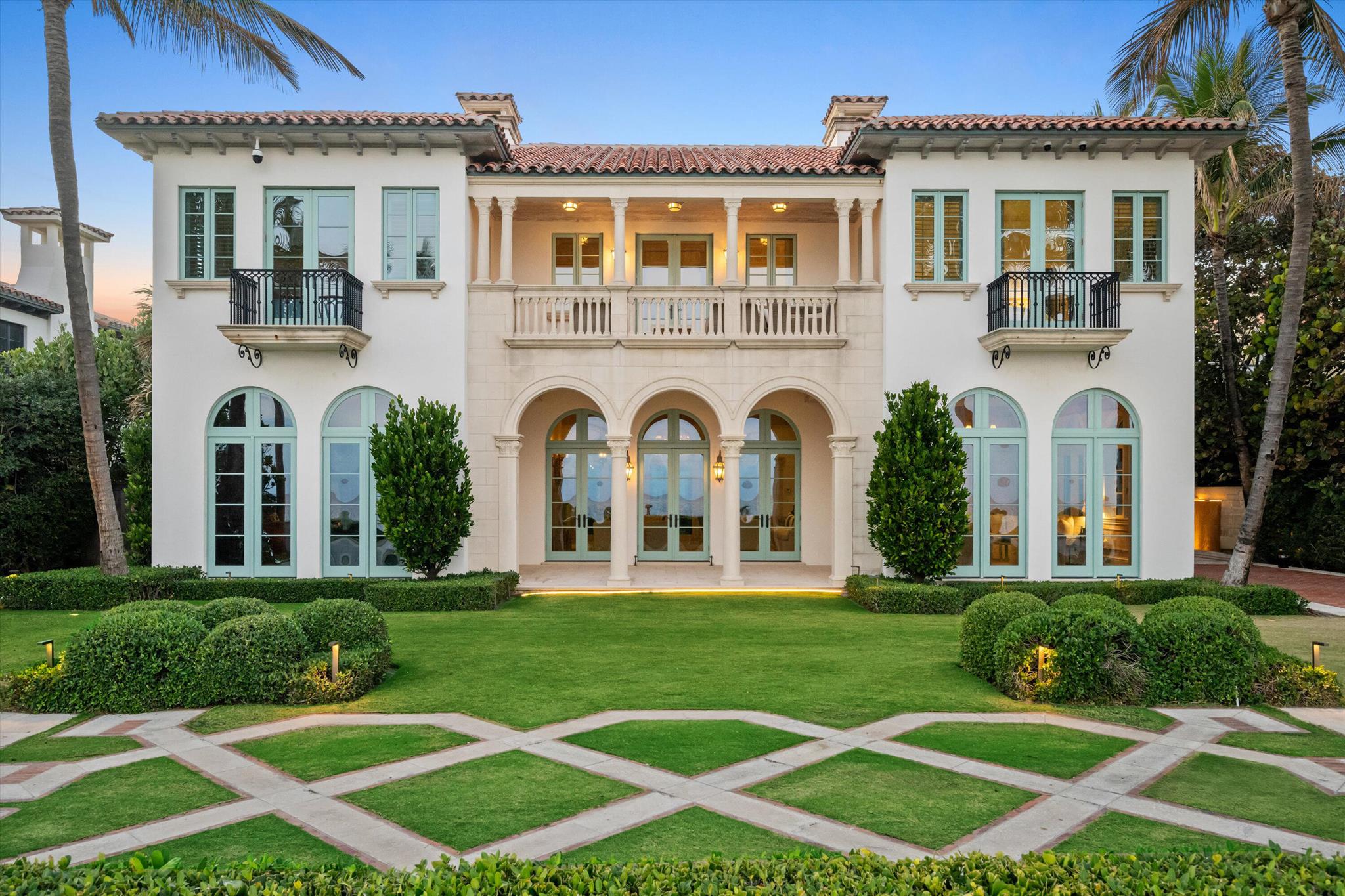 This luxurious Mediterranean oceanfront seven-bedroom estate has been beautifully renovated and is set on over half an acre offering stunning water views with a wealth of amenities for effortless coastal living. Curated by AD 100 designer Daniel Romualdez for gracious entertaining, it features an ocean-view living room with a gas fireplace, a club room with a full bar, a paneled oceanfront library, a day oceanfront living room, a formal dining room, a wood beamed entertainment room, and a gourmet chef's eat-in kitchen with a marble island, high end appliances, and a butler's pantry. Beachside enjoyment is elevated with covered loggias overlooking both the ocean and the pool, an expansive heated pool with a built-in spa, a cabana with a bath, and a shaded patio for poolside dining. Deeded ocean parcel with a 100 feet of ocean frontage. Additional conveniences include an elevator, a 3-car garage, a full-house generator, and two laundry​​‌​​​​‌​‌​​​‌‌​​​‌‌‌​​‌​​‌‌​​​​ rooms.