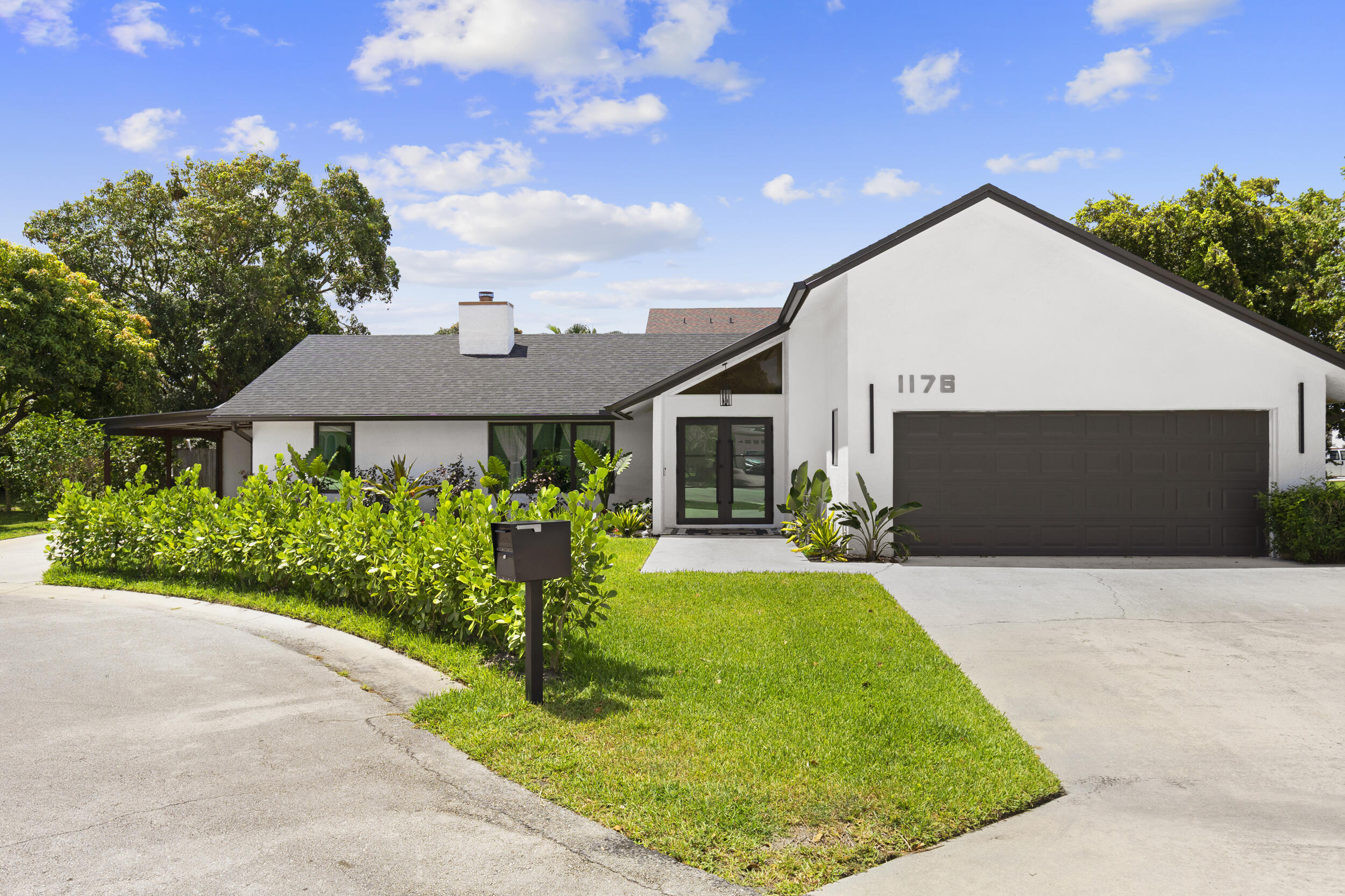 Completely transformed from before to after - you have to see this one in person! This beautifully updated 3-bedroom, 2-bath pool home is tucked away on a private cul-de-sac in a prime no-HOA location in West Palm Beach. Featuring a remodeled kitchen and bathrooms, an open-concept layout, and a desirable split-bedroom floor plan, this home blends style and every day ease. NEW ROOF and partial impact glass windows with added storm protection for the rest. Step outside to your own private backyard sanctuary with plenty of room to entertain, relax, and enjoy South Florida living. The oversized side yard offers additional space for private fencing, boat storage, or other options depending on YOU. Located just minutes from I-95 and 10 minutes to Palm Beach International Airport. Pride of ownership shines in every detail - you can truly feel the love and care the sellers have poured into this home! Other key features: Forno Appliances, Brand New AC, sprinkler system, new Gutters, new fixtures, new luxury vinyl flooring along with porcelain tile.