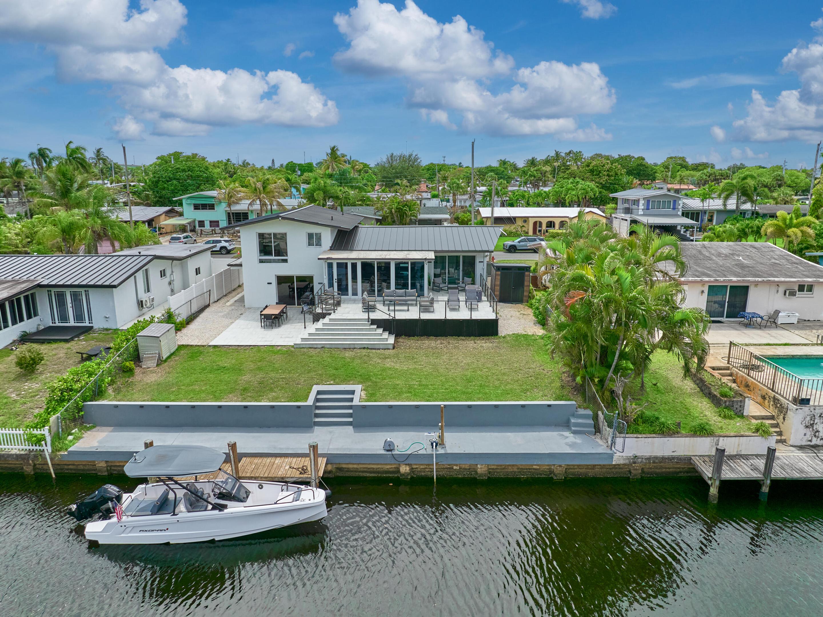 BACK ON THE MARKET AT NO FAULT OF THE SELLER! Welcome to 2426 Key Largo Lane! This waterfront home is a fully remodeled 3-bedroom, 2-bathroom in Fort Lauderdale, offered at $1,165,000. This updated South Florida retreat features modern curb appeal, tropical landscaping, a sleek exterior, and a move-in-ready interior with contemporary finishes throughout. The home opens to a spacious backyard with a large patio, deck area, canal views, seawall, and dock space, creating the perfect setting for outdoor living and entertaining. Enjoy the Fort Lauderdale waterfront lifestyle from your own private retreat, with room to relax, host, and make the most of life on the water. Comes FULLY FURNISHED with no HOA! Schedule your private showing today! NEW ROOF, KITCHEN, DRIVEWAY & ALL PERMITS CLOSED!!