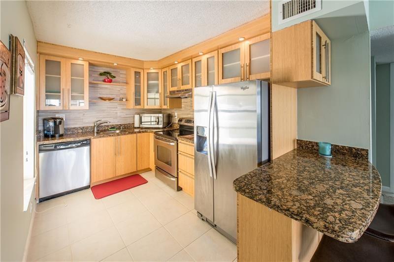 Welcome to Windwood, one of Boca Raton's best kept secrets! Only seconds from FAU, bike to beach, close to I95, and places of worship. This beautiful, open 2/2 condo offers a fully updated kitchen with granite countertops & stainless steel appliances. Large screened in patio with private park view, ceramic tile flooring throughout common areas, and so much more! Residents enjoy a wildlife nature preserve, expansive lake with excellent fishing, 2 sparkling pools with clubroom, tennis, basketball & racquetball Courts, jog & bike trail, dog park, Picnic/Grill Area, and Security Gated community. 24hr guard gated entry + rover security & on site management. LOCATION LOCATION LOCATION in East Boca Raton!