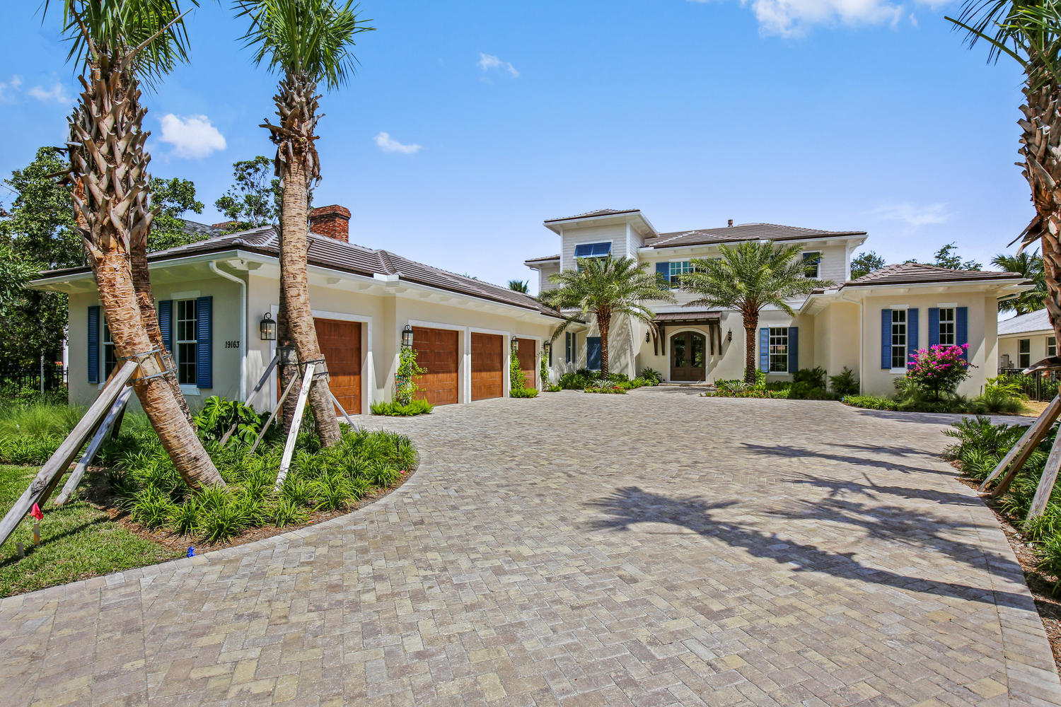 Newly built Coastal riverfront home on gated .92 acre estate. Quality construction, current engineered codes, all impact resistant windows & doors, high energy efficiency throughout and designer finishes. Volume coffered ceilings, hardwood floors, floor to ceiling linear vented fireplace, gourmet kitchen with 2 islands, 2 dishwashers and 48' gas range. First floor master suite, 2 walk in closets, luxurious marble bathrm, Kohler 6' tub and huge frameless shower. Spacious family area, office next to master, paneled elevator, 2nd floor clubroom, extensive covered balcony, Crestron Home Automation System and 20KW propane generator. Tremendous covered loggia with full summer kitchen, heated saline pool & spa, new dock & new 16K lb cradle style boat lift for 38' boat, minutes to Jupiter Inlet!