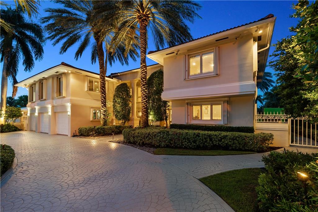 Magnificent, spacious & gated deep water residence offering quality updates & features at every turn. This amazing floor plan w/ two 1st floor bedrooms, three 2nd level bedrooms plus a huge home gym. Real chefs kitchen w/ center island, rich granite counters, Viking six burner gas stove, dual Sub Zero fridge/freezer, ice machine & wine cooler. Formal living & dining rooms in addition to the oversized family room w/ fireplace offering serene views of the pool & water. Must see huge master suite w/ sitting room, romantic gas fireplace & two en-suite lavish bathrooms. A rich combination of marble & wood flooring throughout. Gorgeous professionally designed garden w/ huge infinity edge pool & spa, pool side gazebo w/ full tropical kitchen. State of the art security & whole house generator.