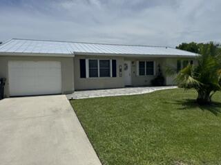 Welcome home to this beautifully updated 3-bedroom, 2-bath home with a 1-car garage, situated on a spacious 0.28-acre lot in a quiet Port St. Lucie neighborhood. This move-in-ready home features a new roof (2023), renovated kitchen with quartz countertops, updated bathrooms, new laminate flooring throughout, fresh interior paint, and new appliances. The hot water heater was replaced in August 2023. Enjoy the added peace of mind of hurricane protection and a security alarm system. Best of all, there is NO HOA, giving you the freedom to enjoy your property without additional fees or restrictions. Conveniently located near a community park and just a short drive to beautiful beaches, shopping, dining, schools, and major roadways. Don't miss this exceptional opportunity!