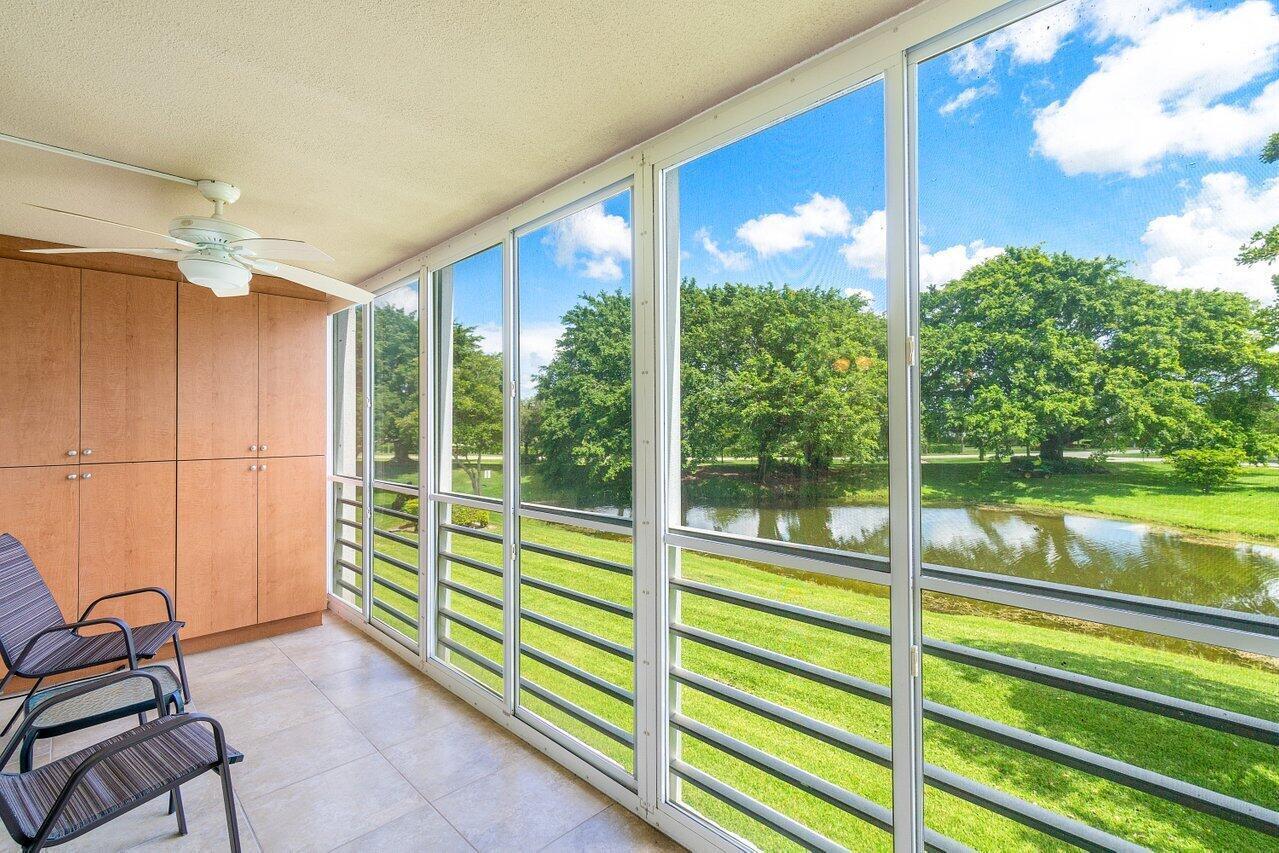 Experience Resort-Style Living in This Beautiful Move-In Ready Waterfront Condo!  Discover the ultimate 55+ lifestyle in one of South Florida's premier communities. This bright, move-in-ready waterfront residence offers serene lake views and is located in the well-maintained Rexford community, featuring a new 2026 roof along with several additional building improvements already approved at no cost to the owners—providing exceptional value and added peace of mind.  Start your day with tranquil water views and enjoy your morning coffee from the screened-in patio. Ideally situated near the elevator and laundry room, this condo offers everyday convenience, while the assigned parking space just outside the building and abundant storage make daily living effortless. Century Village is renowned for its exceptional resort-style amenities, highlighted by a 125,000-square-foot clubhouse featuring a state-of-the-art fitness center, library, art studios, grand ballroom, billiards, card rooms, and a live performance theater. Residents also enjoy tennis and pickleball courts, shuffleboard, bocce ball, a putting green, indoor and outdoor pools, fishing areas, and convenient community transportation.  This stylish Rexford residence truly stands out as one of Century Village's finest. Schedule your private showing today and experience the perfect blend of comfort, convenience, and active​​‌​​​​‌​‌​​​‌‌​​​‌‌‌​​‌​​‌‌​​​​ living.