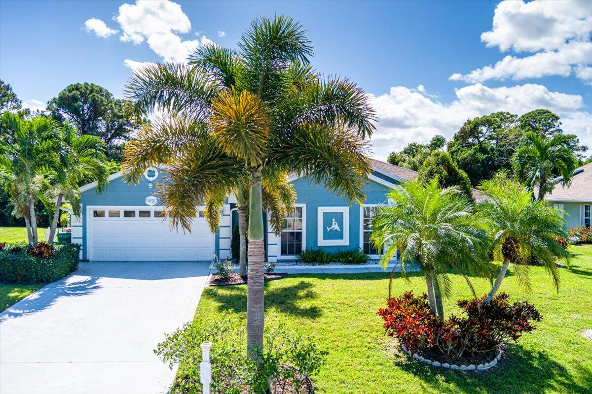 Welcome to Oleander Pines! A perfect place for your winter getaway or for raising your family. Quiet streets give peace of mind for your kids to ride their bikes and enjoy the outdoors! Fenced backyard with a HUGE screened patio as well as an extended patio is perfect for grilling and enjoying quality time. Also enjoy the top of the line hot tub on those cooler Florida nights! Inside you will find tile and laminate flooring throughout, a spacious split bedroom floorplan and separate living and family room. Granite in the kitchen, ss appliances, a reverse osmosis water machine in the kitchen and also a whole home filtration system in the garage. All major updates are done with a new roof in 2021, new AC and all new ductwork in 2021, new AO Smith water heater in 2024 with new expansion tank and copper piping. Seller has updated the electrical panel as well. Enjoy lower, county only taxes!!! Easy to show!