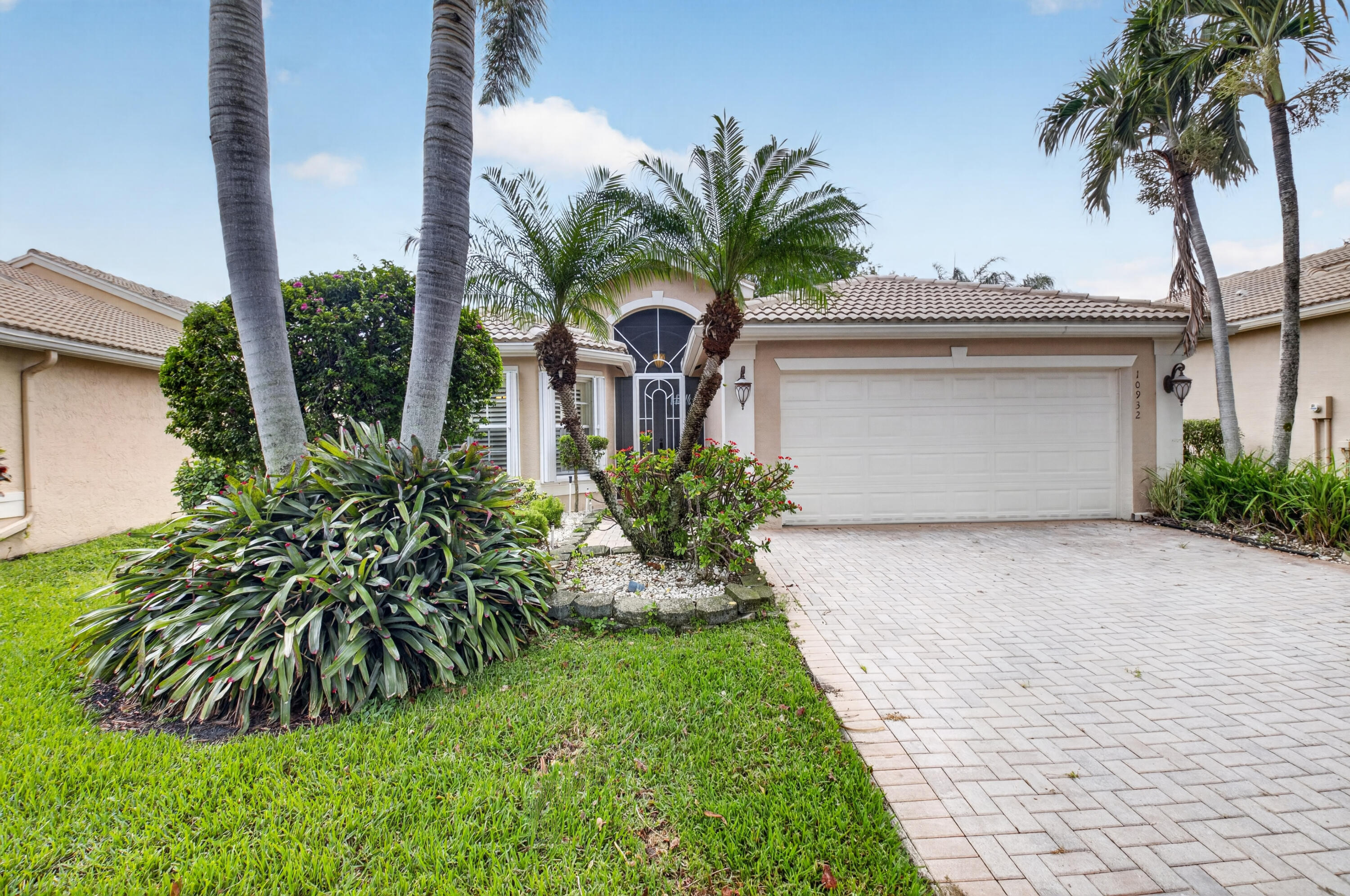 LUSHLY LANDSCAPED INTERIOR LOT. ALL TILE FLOORS, UPGRADED KITCHEN WITH  REPLACED NEVER USED STAINLESS  STEEL APPLIANCES.  FRESHLY PAINTED PRIMARY BEDROOM AND BATH.  FEATURING PLANTATION SHUTTERS.  FURNITURE AVAILABLE FOR SALE.  EXCLUDE ART AND ELECTRONICS.  NO SPECIAL ASSESSMENT AT THIS TIME. MAINT. INCLUDES A $475 CAFE CHARGE WITH 2 CARDS PROVIDED PER YEAR, PLUS MAINTENANCE INCLUDESS, LANDSCAPING,CABLE,PAINTING EVERY 3 YEARS,RESORT STYELE AMENETIES,ALARM MONITORING,24HR GAURD GATE,TREE TRIMMING FRONT YARD. THIS PROERTY IS IN PROBATE.