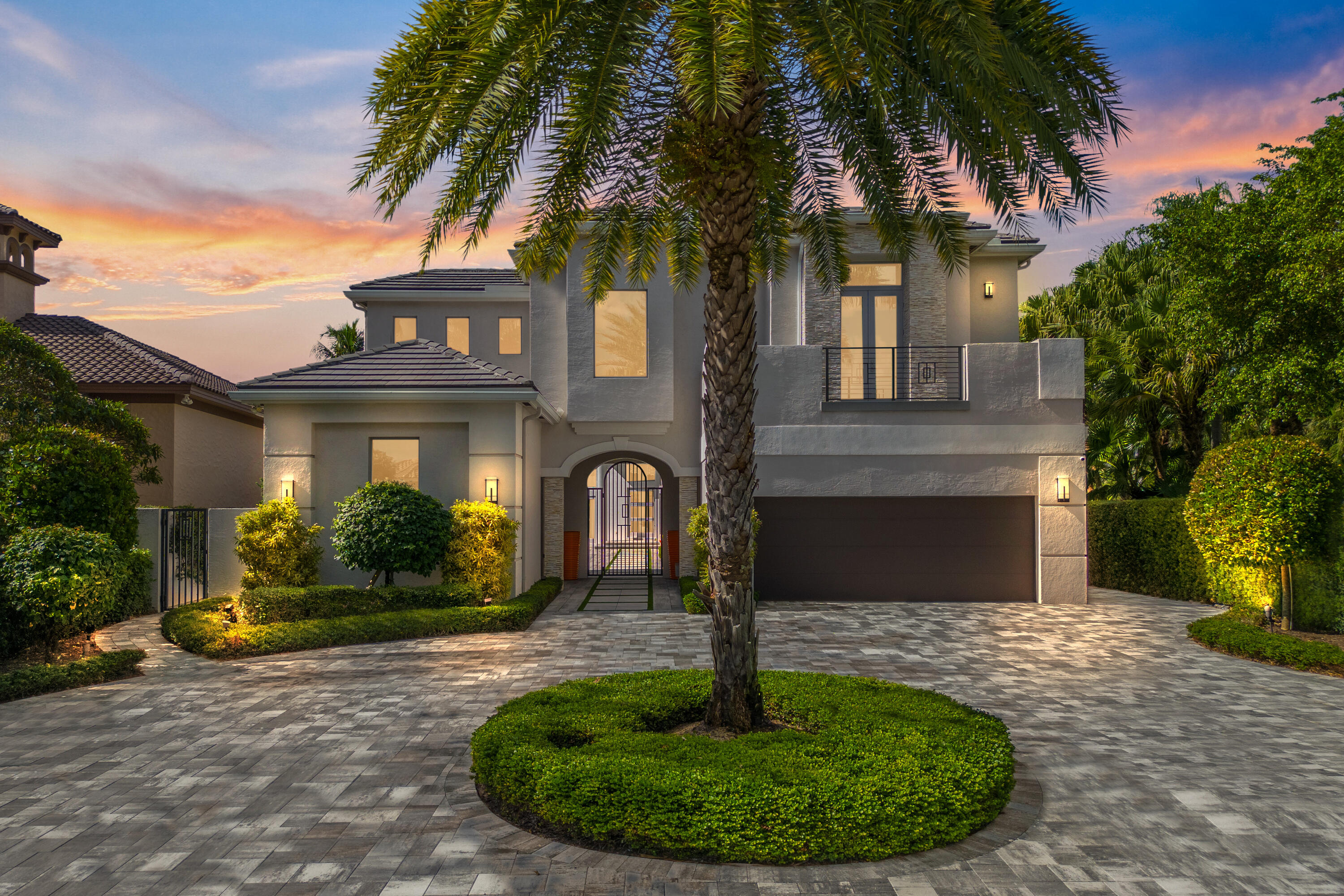 Size and Layout: The residence is a 2-story estate home with a guest house and includes 4,892 sq. ft. under air. It offers 5 bedrooms, 6 bathrooms, and an office. Oversized 2 car garage + golf cart garage with a separate entry. The loft area provides versatile space that can be customized to suit your needs, such as a playroom, entertainment area, or additional home office.

Luxury Features: The home is meticulously designed with high-end features and finishes. It showcases Italian porcelain flooring in the main home, courtyard, and garage, adding a touch of elegance. Hurricane impact windows and doors provide safety and protection. The property also includes a generator with a 1000-gallon tank, ensuring uninterrupted power supply. The kitchen offers custom glass cabinetry, Wolf and Subzero appliances, and the most gorgeous kitchen counter! New tile roof, upgraded LED chip lighting, and the impressive pivot front entry door contribute to the modern luxury of the home.

Technology and Sound System: The property is equipped with modern technology features that you can access from your phone, including 4 air conditioners, cameras, most lights, alarm and a Sonos system with sound bars throughout the interior and the courtyard. This allows you to enjoy high-quality audio throughout the home. Additionally, the home features a Kinon wall system, enhancing the aesthetic appeal. 

HVAC and Appliances: The home is equipped with 5 air conditioning units, all of which were replaced between 2017 - 2023. This ensures efficient cooling and climate control throughout the property. All appliances in the home were also upgraded in 2017, providing modern functionality and energy efficiency. The property includes two tankless gas hot water heaters delivering hot water on demand.

Outdoor Oasis: The estate is situated on a spacious lot offering privacy and a stunning lake view. The courtyard area features lush landscaping and separate heaters for the pool and spa, creating a peaceful oasis where you can relax and unwind.

Prestigious Community: This gem is located in the Hidden Cove community of the renowned Polo Club, known for its exclusive lifestyle and amenities, world-class dining, facilities, social events, and services.  Please note that membership in The Polo Club is mandatory.