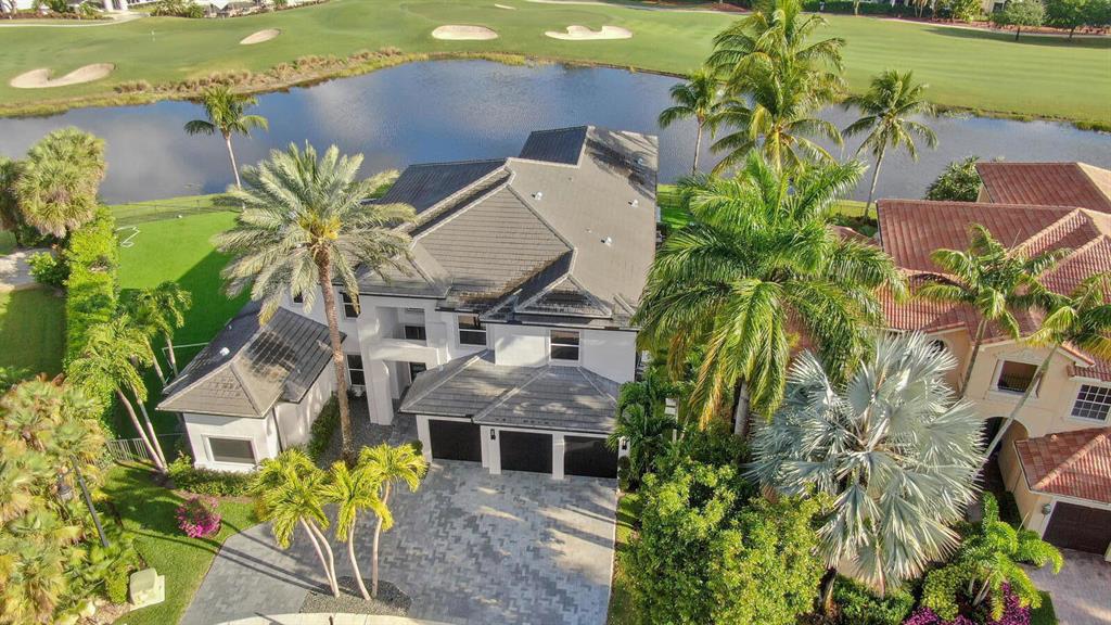 Luxury and sophistication define this contemporary estate , built in 2019 and offered turnkey.Elegant residence with 6160 Sqft under air. High end custom finishes throughout. Grand entrance opens up to a centrally located living room with stunning floor to ceiling windows.The glass floating signature staircase is tucked behind the expansive dining room table with seating for 12. The glass wine room is well located between dining and gourmet kitchen. Main bedroom on 1st floor with his and hers built in closets.
Media room on 1st floor with 3 TV's.
 2nd floor , 2 en suite bedrooms and large entertainment area. Resort style pool with 40 X 20, surrounded with porcelain tiles, summer kitchen offering sweeping views of the golf course and clubhouse. Whole house generator with 2 large tanks. Garage is AC controlled, cooktop Gas , Miele Appliances. 60inch Porcelain tiles, granite driveway, bedrooms custom wood floors.