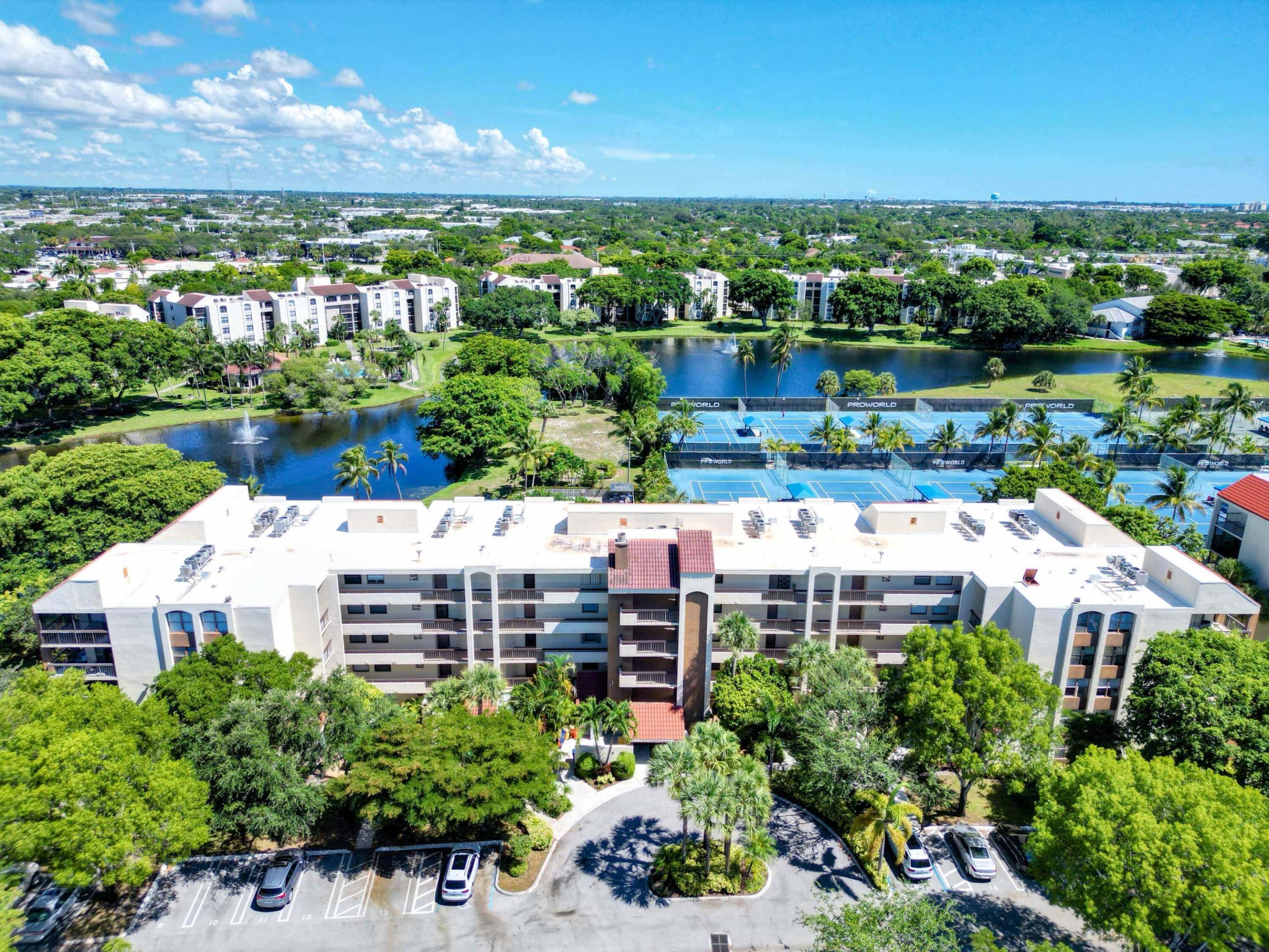Available for the 2027 season only! Escape to the South Florida lifestyle in this beautifully updated, turnkey 2-bedroom, 2-bath corner condo in the highly desirable Delray Racquet Club. One of the community's larger floor plans with approximately 1,400 sq. ft., this fully furnished residence is move-in ready for your seasonal stay. Enjoy a spacious wraparound screened patio with beautiful lake views—the perfect place for morning coffee or evening relaxation. Hurricane-impact windows and sliding glass doors fill the home with natural light, while the open layout features all-tile flooring (no carpet), recessed lighting, a large laundry room with an in-unit washer and dryer, and a relaxing Jacuzzi tub in the guest bathroom. Just steps from the community pool. Rent includes WiFi, cable, water, and assigned parking. Delray Racquet Club offers resort-style amenities, including heated pools, a spa, fitness center, tennis courts, racquetball, and scenic walking paths. Ideally located within walking distance of Whole Foods, Target, and numerous restaurants, and just minutes from Publix, Trader Joe's, the beach, and the vibrant shops, dining, and entertainment of Atlantic Avenue in Downtown Delray Beach. Seasonal rentals in this location are in high demand—reserve your South Florida getaway today!