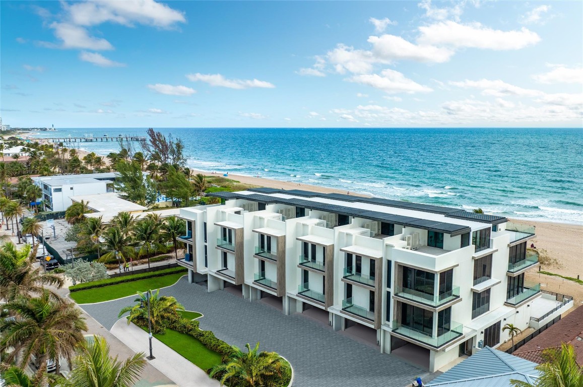 Ocean Six Terraces: Occupancy August 2024, exclusive community of six oceanfront townhomes perfectly situated on the sand in Pompano Beach, South Florida’s charming and secluded beachfront destination. Unit 2 residence includes: private pool and cabana, your private rooftop oasis, offering stunning ocean and sunset views from the privacy of your own home. Private elevator, smart home, exquisite designer kitchen with upgraded chef inspired appliances, Toto/Kohler bath fixtures, modern design and contemporary finishes.  Enjoy an elevated lifestyle with this exclusive offering of Unit 2: 4,048 A/C s.f., 388 s.f balconies and 1,124 s.f. roof top terrace, 4 bedrooms, 4.5 bath, private 2 car garage and home automation living. Designed by Studio KHORA.