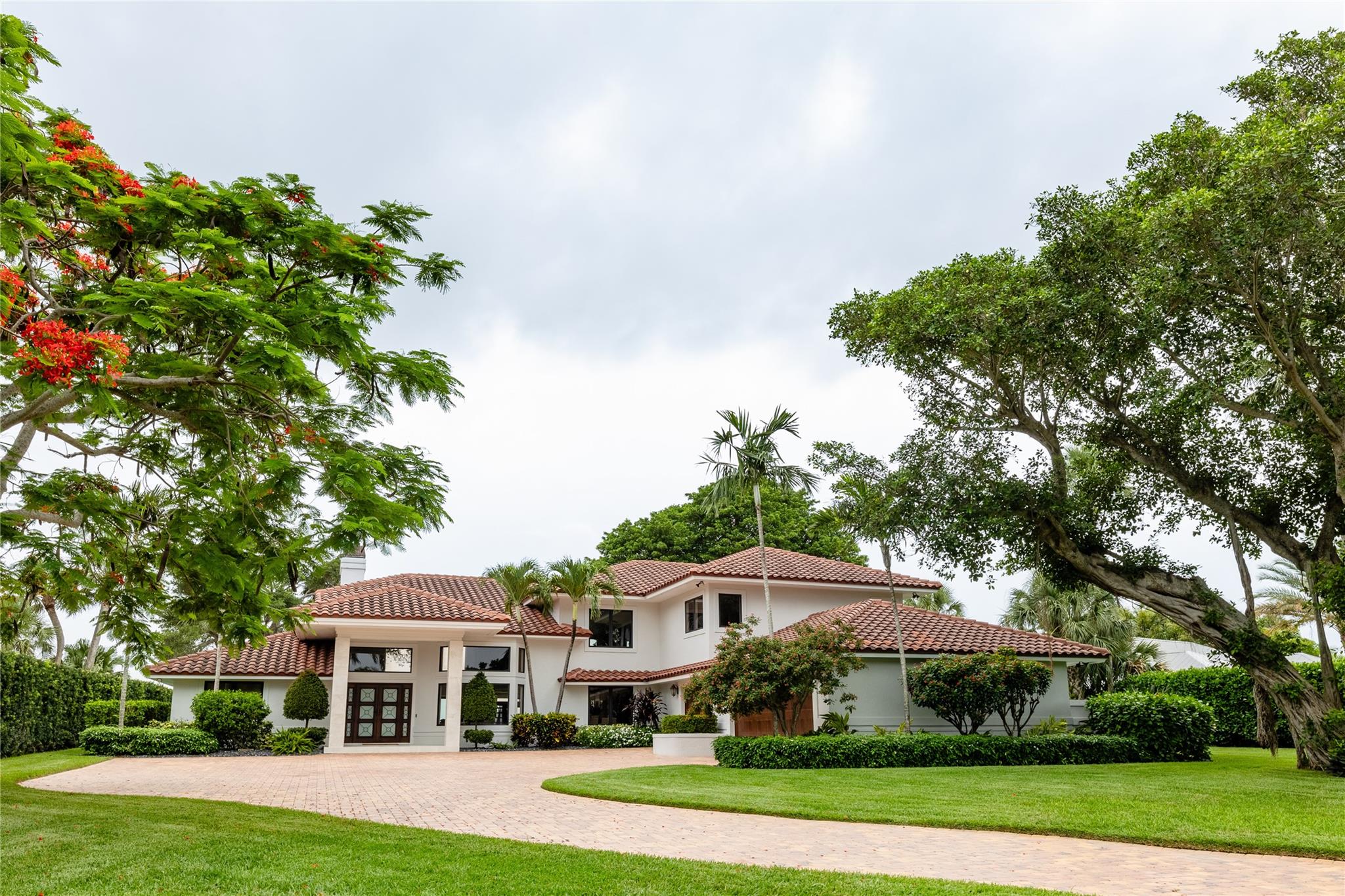 A rare offering in prestigious Sewall’s Point, this 6-bedroom, 4.5-bath waterfront estate has been exquisitely reimagined with over $1 million in thoughtful enhancements. Gracefully set behind lush privacy hedges with sweeping open-water views, the residence combines timeless elegance with enduring strength—featuring new garage doors, a brand-new seawall, and a custom-designed switchback path to the water. The state-of-the-art brand new dock includes a 30,000 lb solar-powered lift and a metal roof. Inside, the gourmet kitchen is appointed with Wolf and Sub-Zero appliances, while an elevator and 1,000-gallon propane tank reflect the home’s commitment to comfort and resilience. A sanctuary of luxury in the heart of Florida’s premier boating haven.