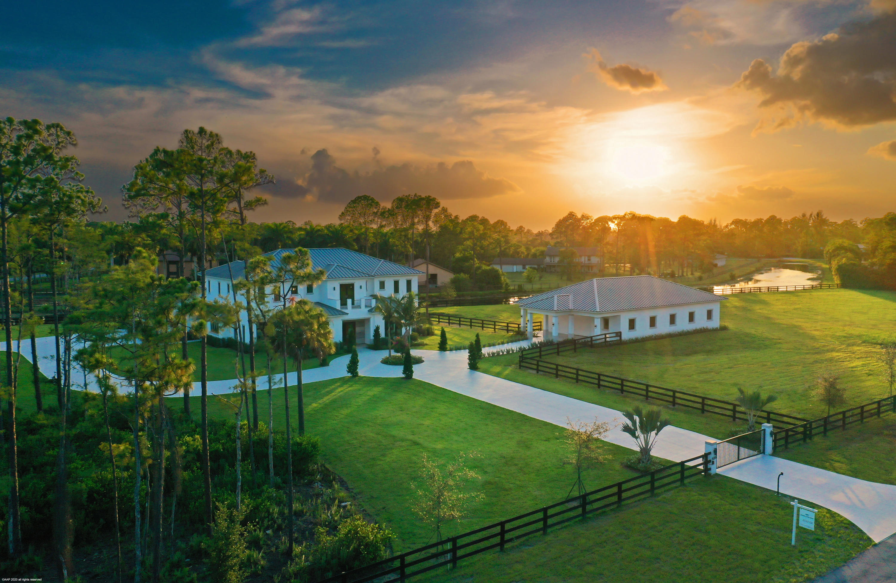 Brand New Equestrian Estate! This beautiful 5Br/ 6.5Bth modern-transitional home is a must see w/ it's open floor plan, custom mill-work, wood floors, 2 luxury master-suites perfectly  situated on 5 cleared acres w/ a center-isle stable w/ up to 10 stalls. The center-island cooks kitchen boasts, double wall ovens, 2 sinks, 2 wine coolers, dual dishwashers and opens to the living areas; perfect for the entertaining style of today. Adjoining the kitchen is a gracious formal dining room with wet bar with open views to the property.  There are two master suites, one on each level both with his & her bathrooms with shared shower rooms.  The elevator near the beautiful spiral staircase provides easy access to the upstairs.  Along with the 2nd master upstairs you'll find a family loft w/ balcony. On the first floor you will also find his and her offices with custom built-in bookcases wired for entertainment componants.  Pool-side you will enjoy the full summer kitchen and bar counter with gas cook-top, refrigerator, refrigerated beverage drawers, dishwasher and sink.  The screened, heated pool & hot tub are surround by marble decking and covered sitting areas.  A great extended living and entertaining area with outdoor shower and full cabana bath and changing room.

For the equestrians: the seller is offering a $50k allowance towards your custom build out of the stable.  The perfect solution, allowing you to make it your own. The 3,000 Sq.Ft. stable can fit up to 10 stalls and allows for a 14'6" isle-way.

Other features:
Hardwood Oak & terrazzo tile floors.
Breakfast bars in each Master bedroom
4 zone AC - with 8 sub zones.
The home is wired for a full-house generator with transfer switch.
Electric heated and salt chlorinated pool.
Quartz counters tops in the kitchen & Quartzite in bathrooms.
120 Gal commercial hot water heater.
Tiled garage floor.
700 Sq. Ft. storage over the garage.
Borel Wood ceiling finishes in outdoor areas & stable (3 times more costly then wood but won't rot, warp & insect resistant).
Anderson Window & Doors.
5/8" drywall construction
12' high ceilings.
4" well pipe offering higher water pressure.