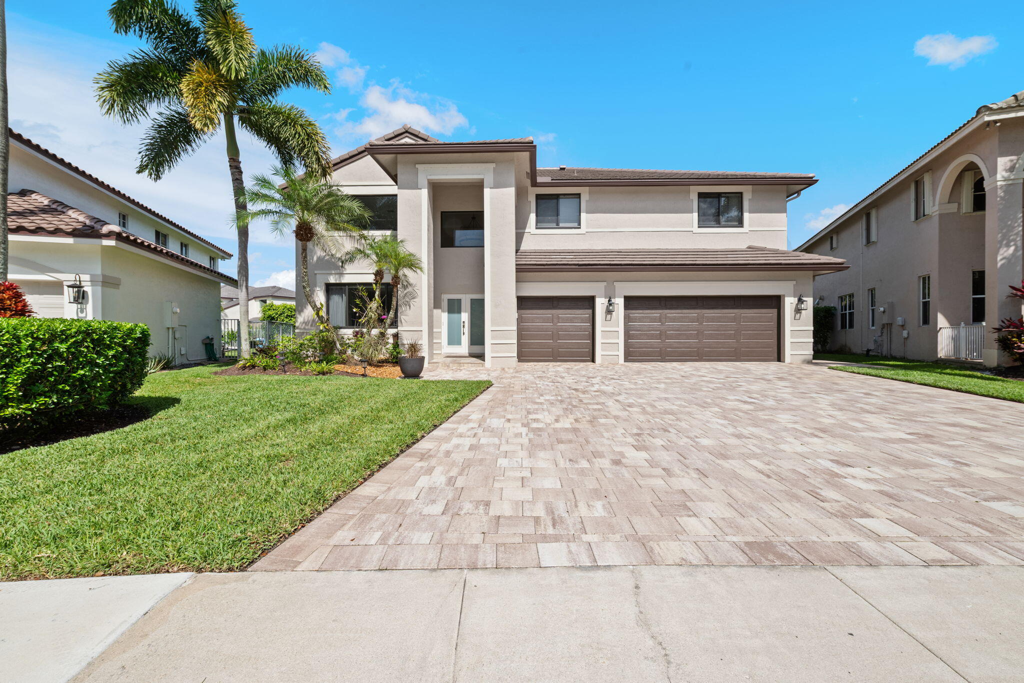 Yes, a completely and tastefully upgraded home in The Meadows of Weston truly exists. From the roof to the flooring, the driveway to the backyard, every detail inside and out has been fully renovated. This pristine, move-in-ready property requires absolutely zero post-closing investment.  New Roof: 2022.  New A/C units: 2024.  Impact windows/doors:  2022.  Impact Garage Door: 2020.  3-Car Garage + 6-Car Driveway.  Flex Space Room (bedroom/office/nanny) on 1st floor adjacent to full bath (one of 4).  Chef's conveniences in the upgraded quartz kitchen.  Luxurious Owner's Suite w/upgraded free-standing tub & glass shower, huge walk-in closet.  Total of 5 BR's & 3 baths on 2nd floor.  Fenced backyard oasis w/roofed shady 300 sq ft patio, heated pool/overflow spa.  24/7 guard gated community.